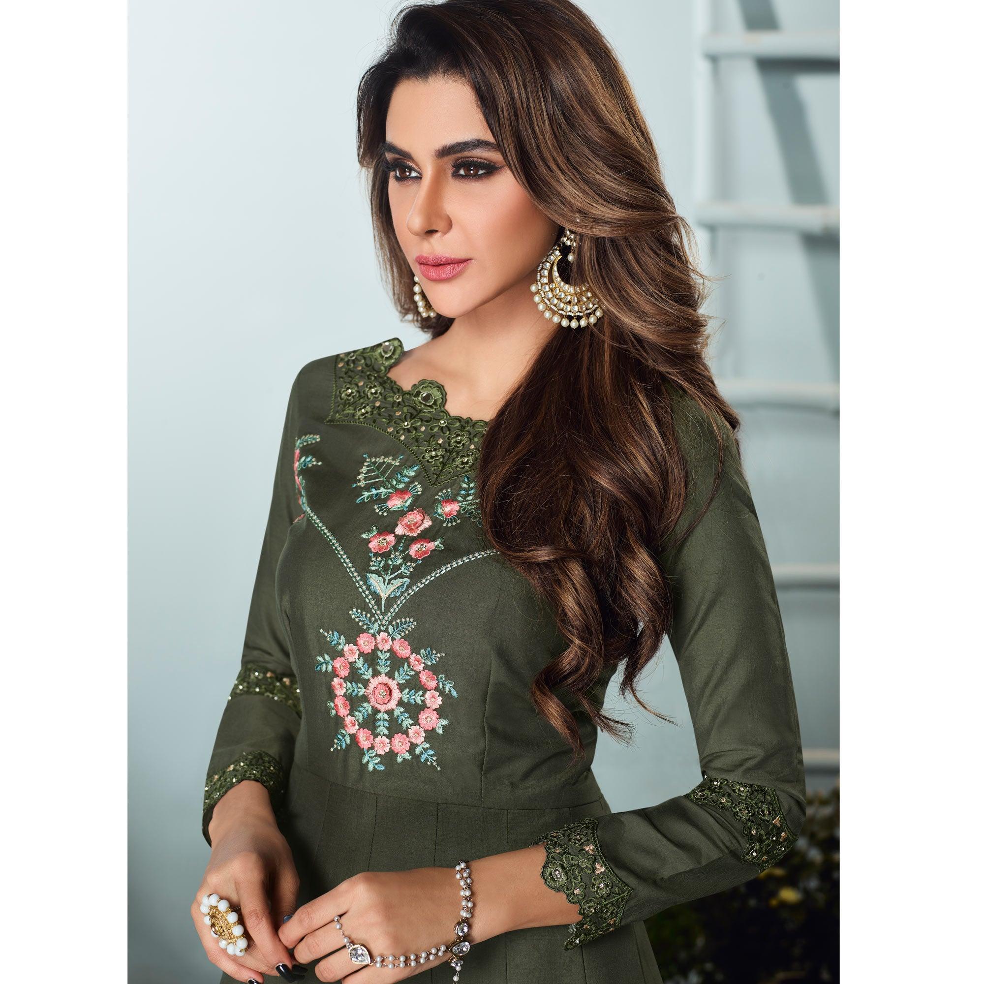 Capricious Dark Olive Green Colored Party Wear Embroidered Muslin Cotton Silk Gown - Peachmode