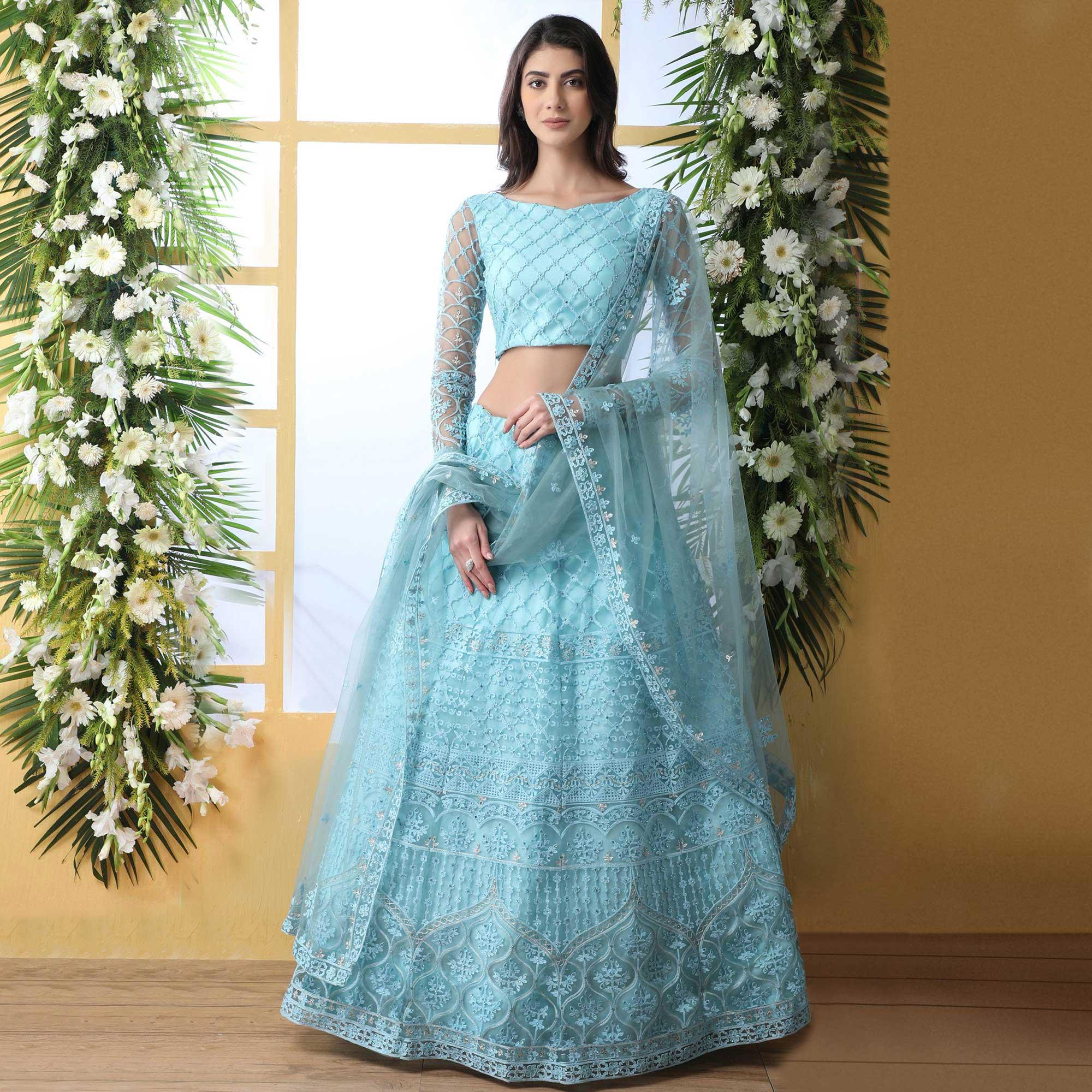 Capricious Sky Blue Colored Partywear Embroidered Netted Lehenga Choli - Peachmode