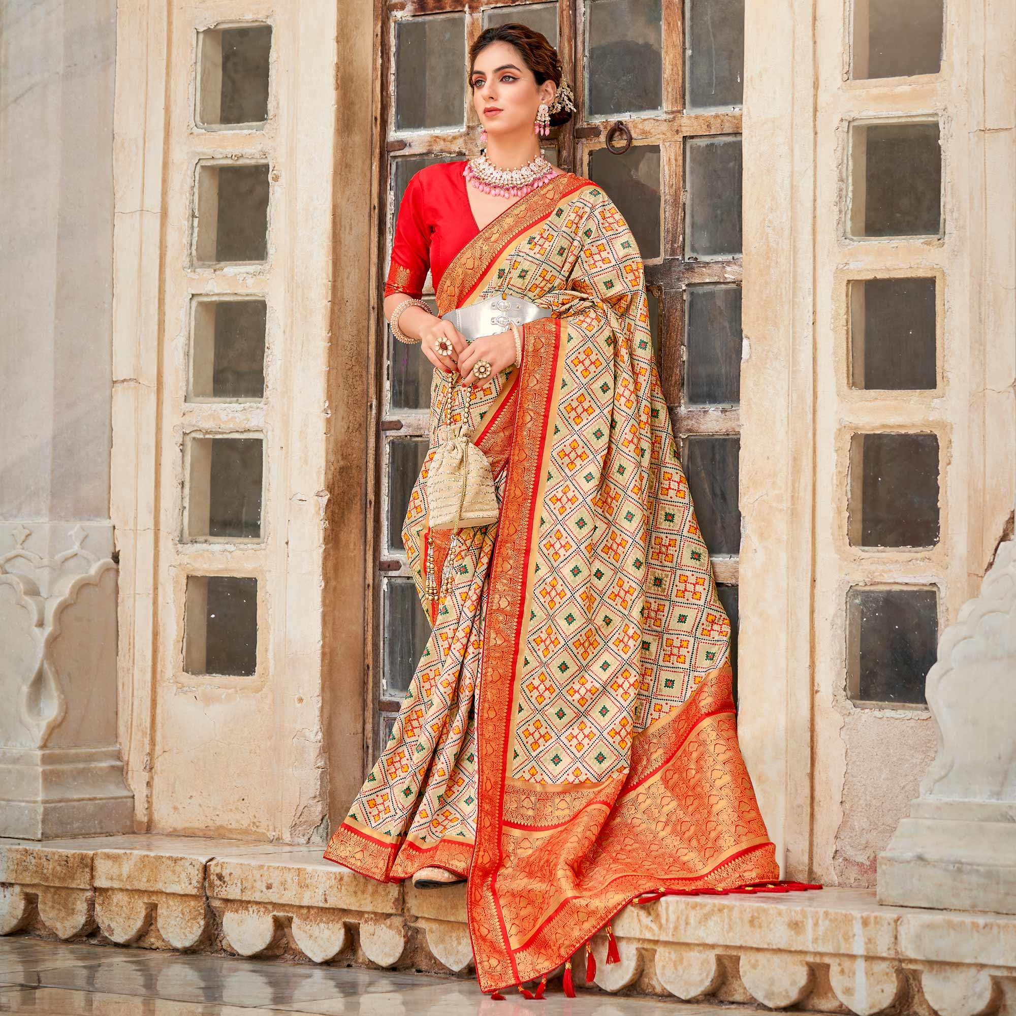 Chikoo Woven Art Silk Patola Saree With Tassels - Peachmode