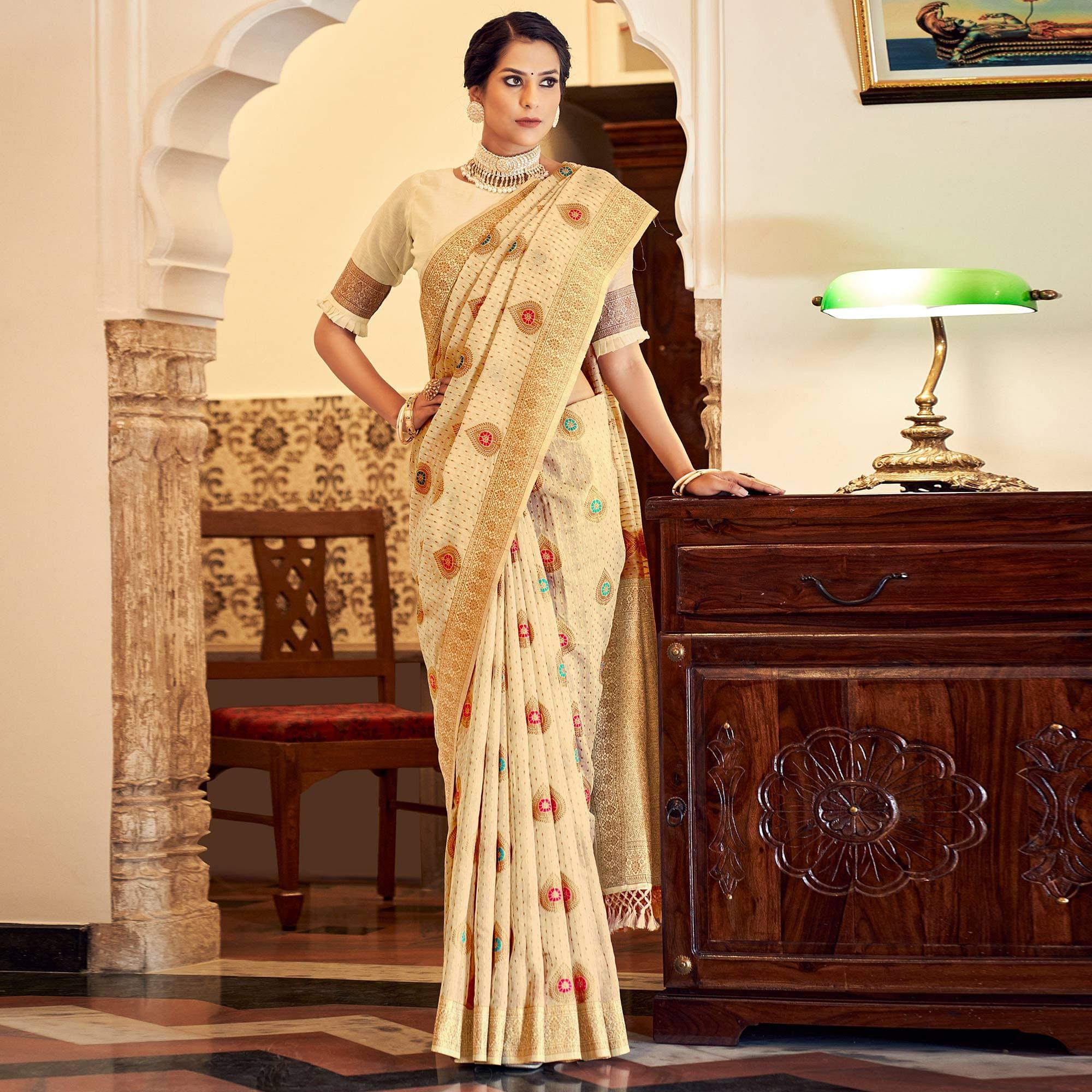 Cream Festive Wear Woven Banarasi Saree With Tassels - Peachmode