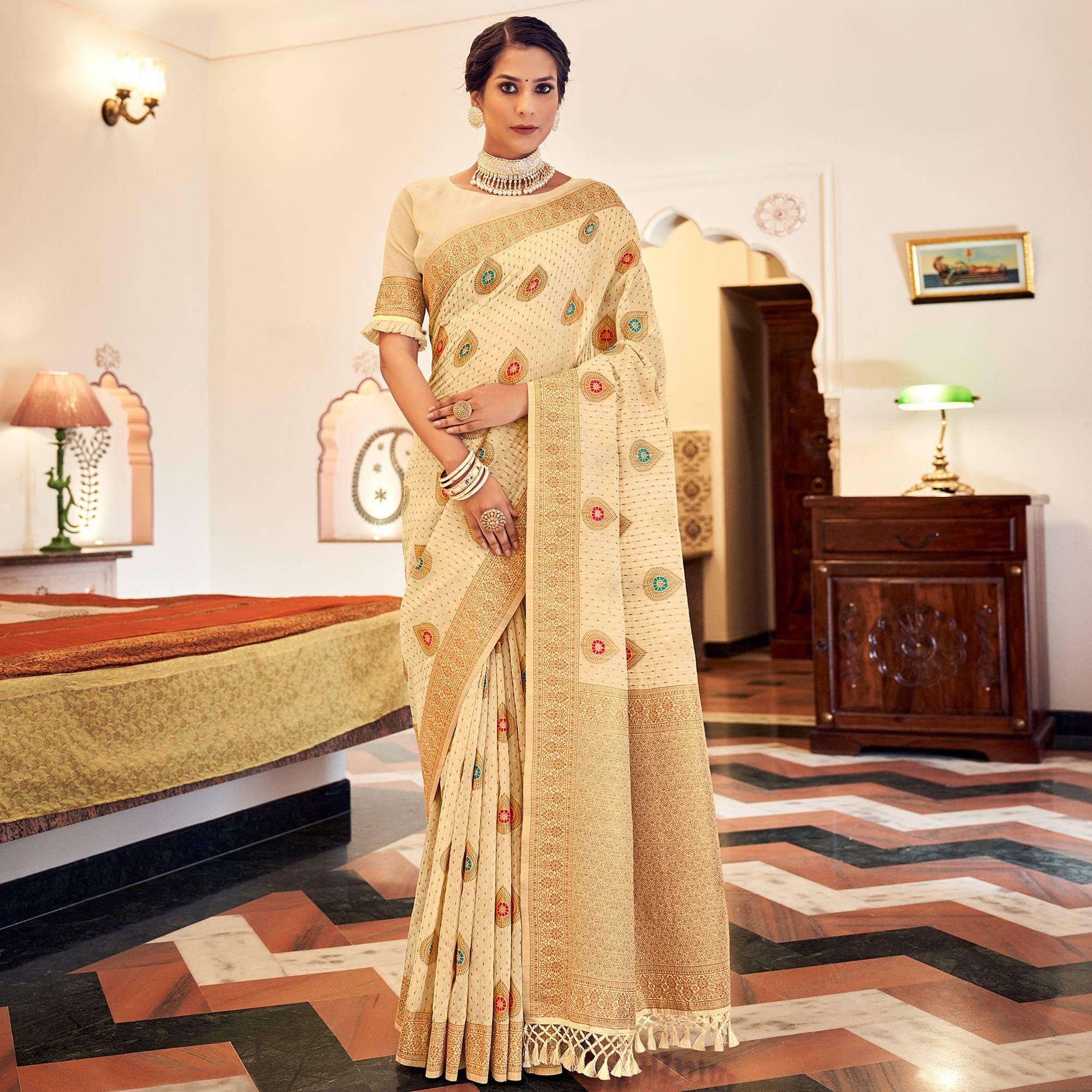 Cream Festive Wear Woven Banarasi Saree With Tassels - Peachmode