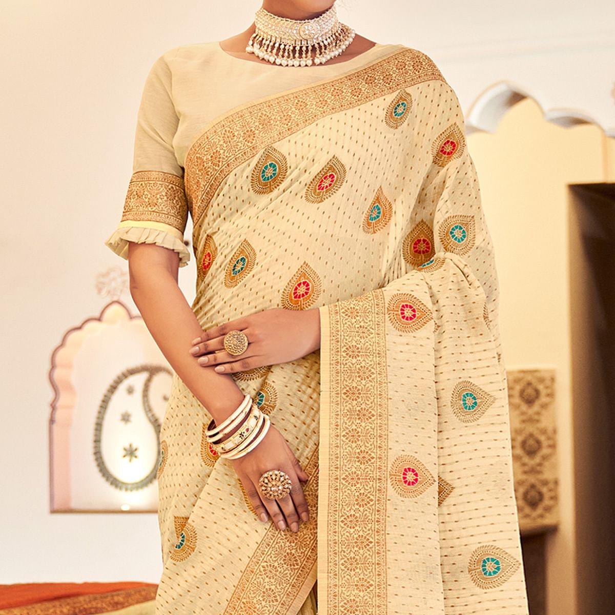 Cream Festive Wear Woven Banarasi Saree With Tassels - Peachmode