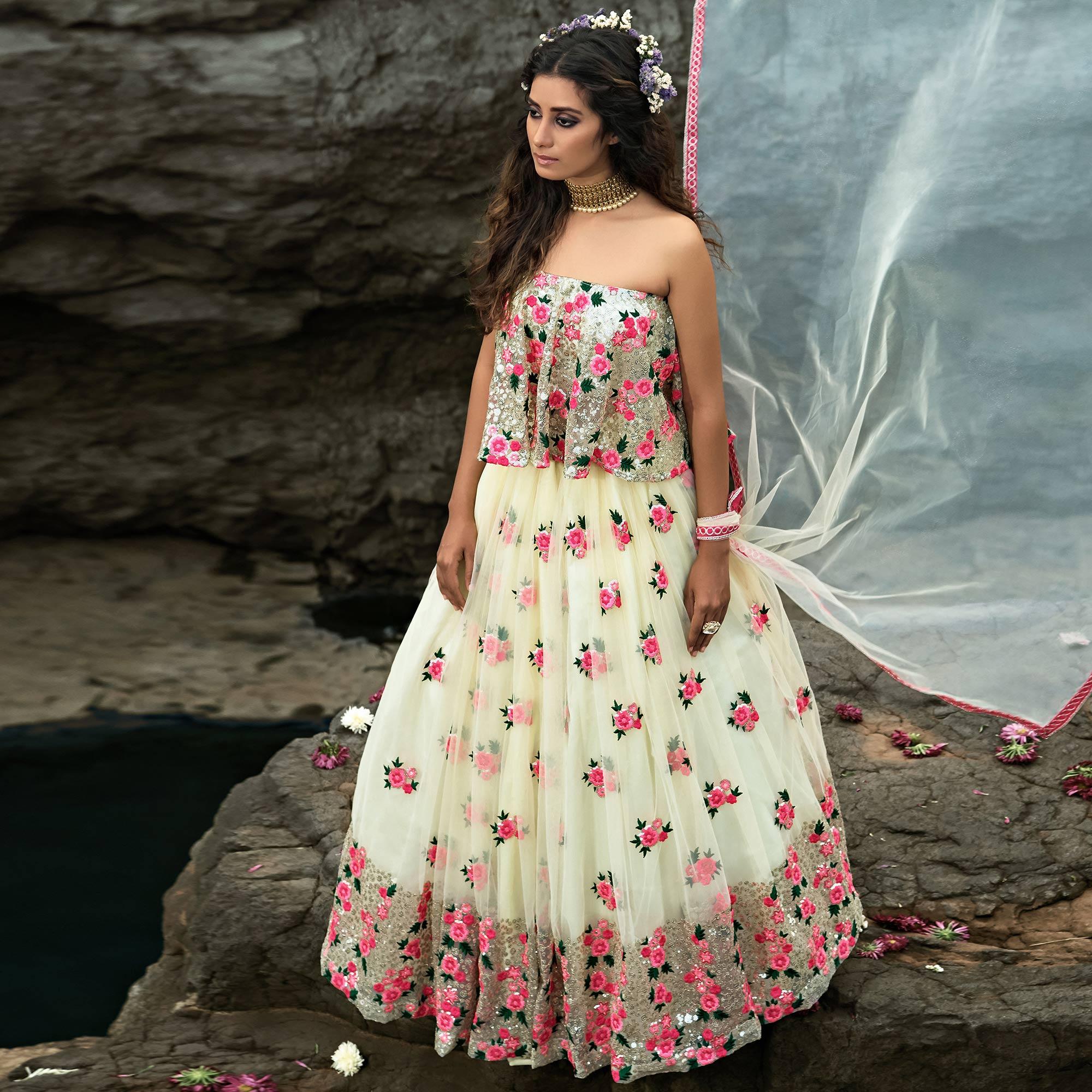Cream Partywear Sequence Embroidered Soft Net Lehenga Choli - Peachmode