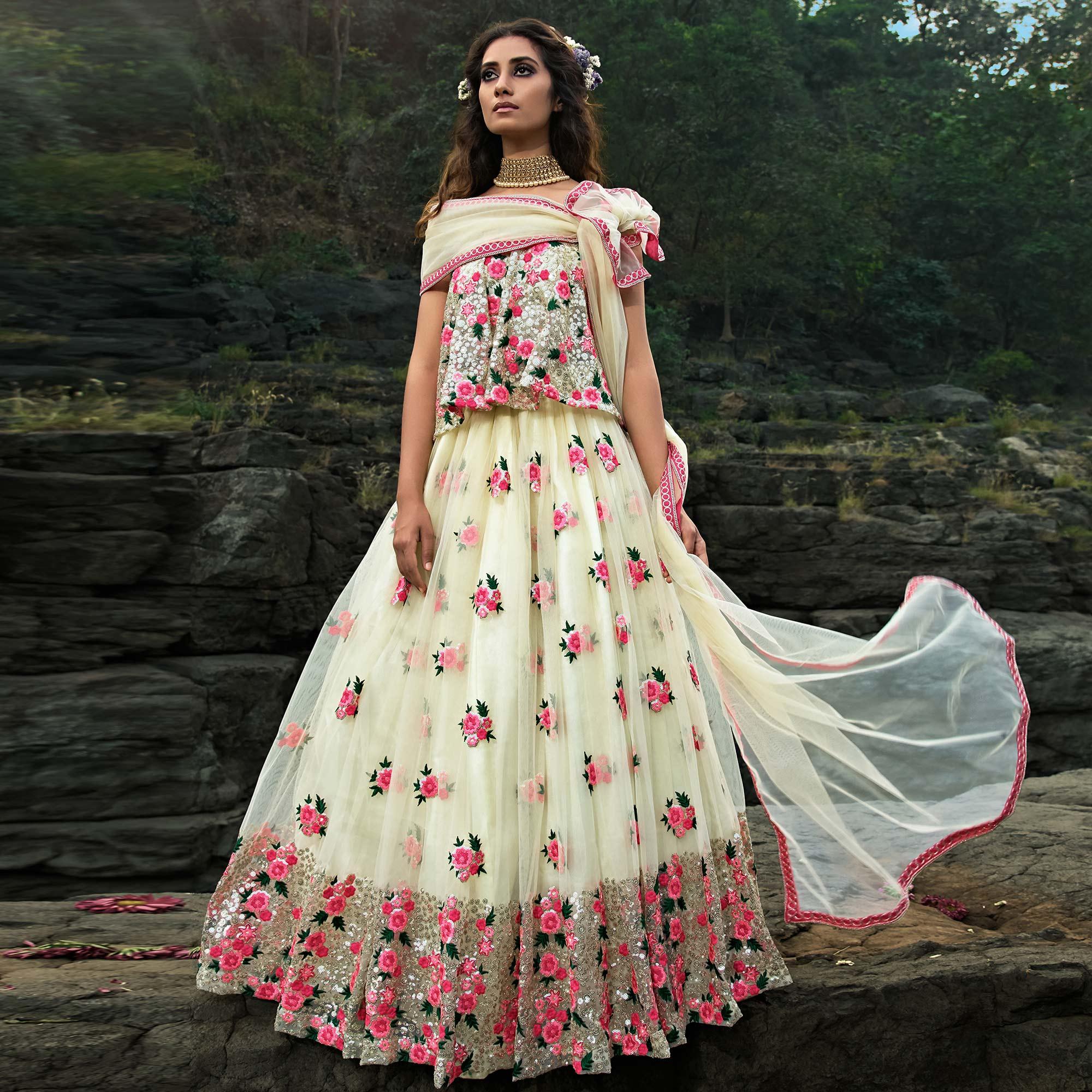 Cream Partywear Sequence Embroidered Soft Net Lehenga Choli - Peachmode