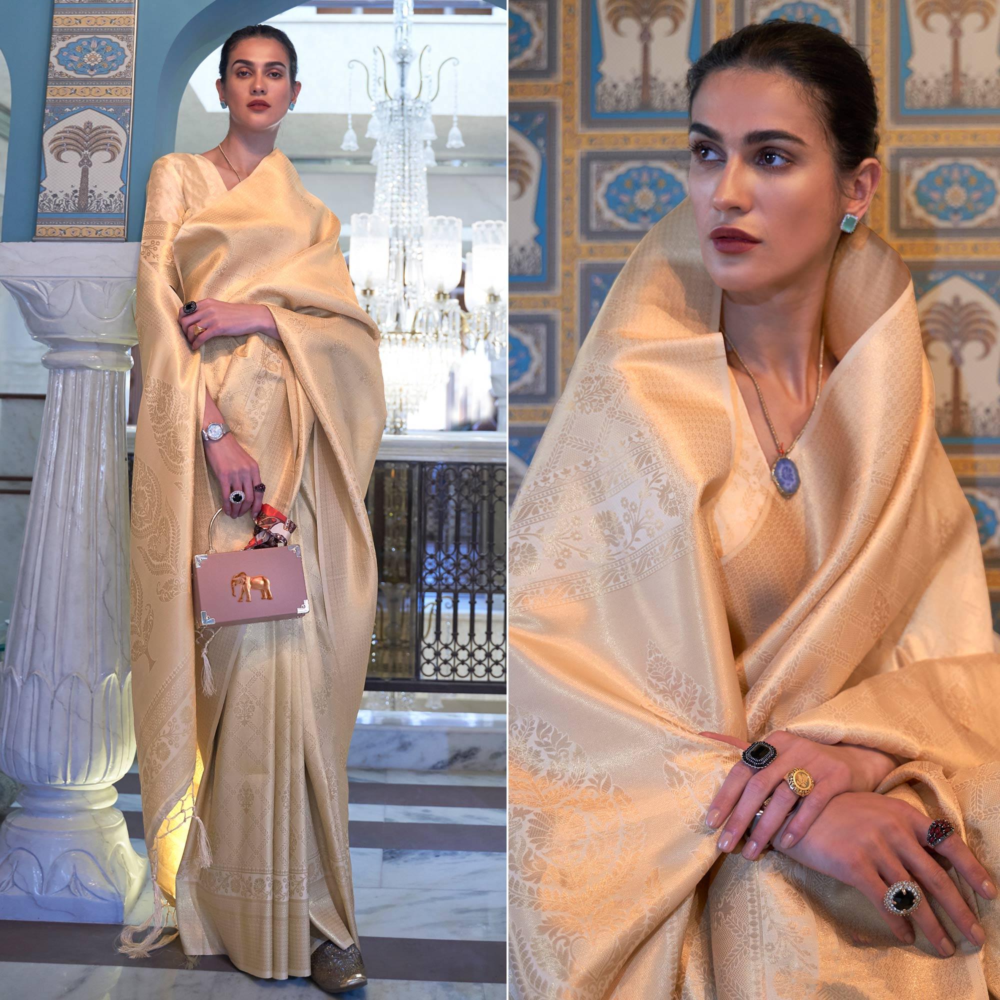 Cream Woven Art Silk Saree With Tassels - Peachmode