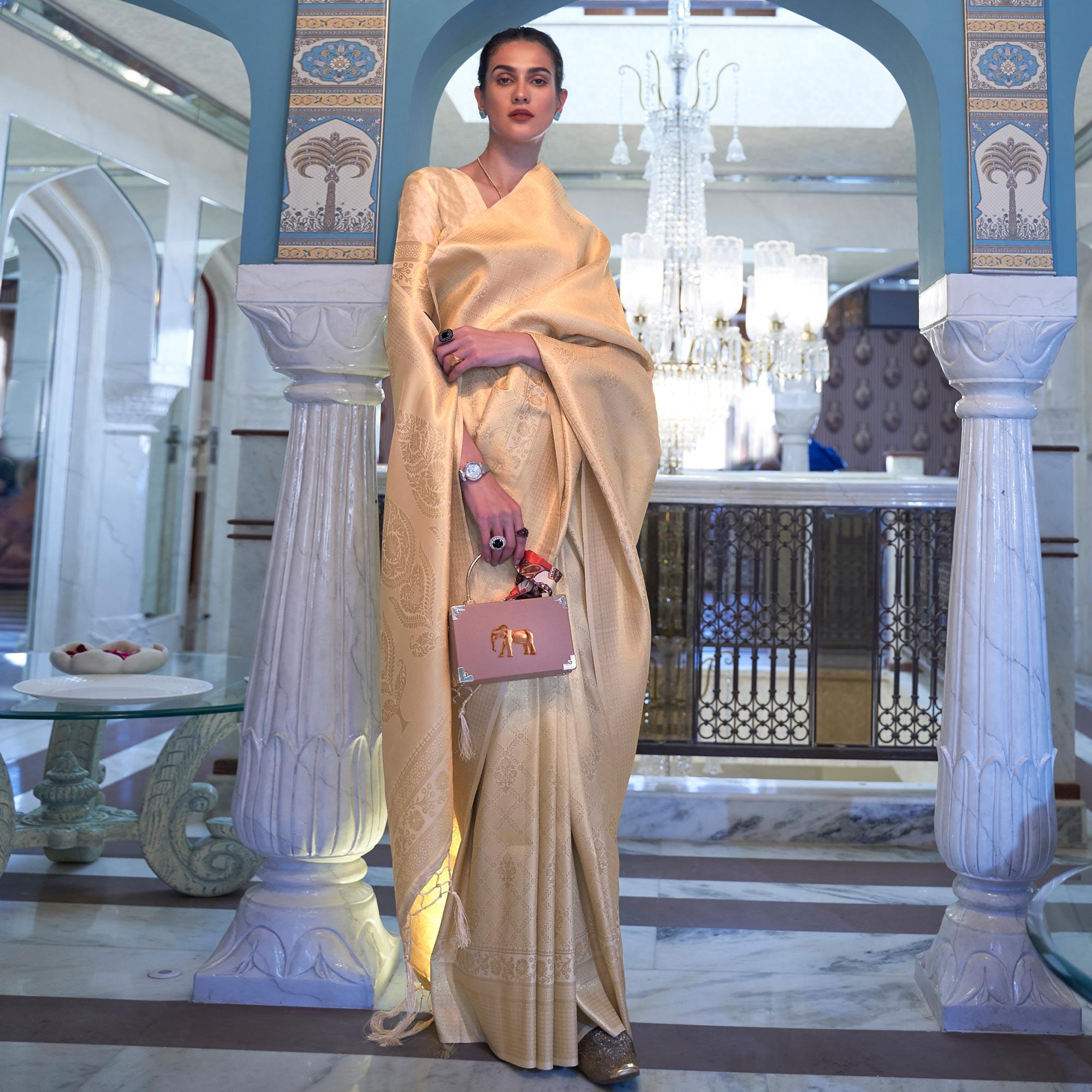 Cream Woven Art Silk Saree With Tassels - Peachmode