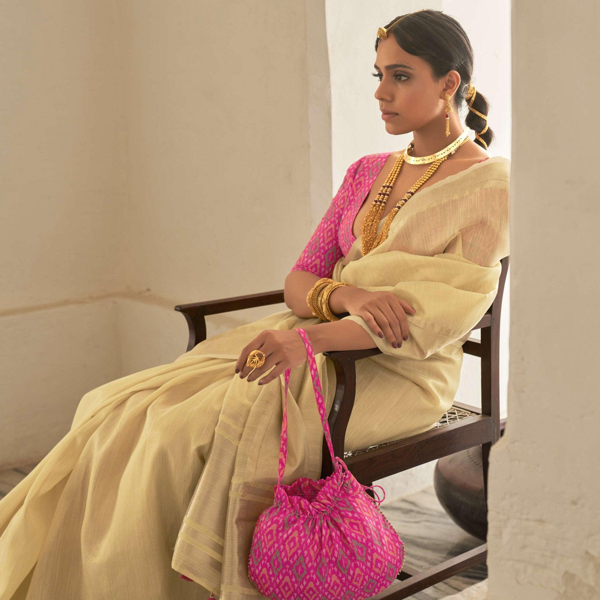 Cream Woven Organza Saree With Tassels - Peachmode
