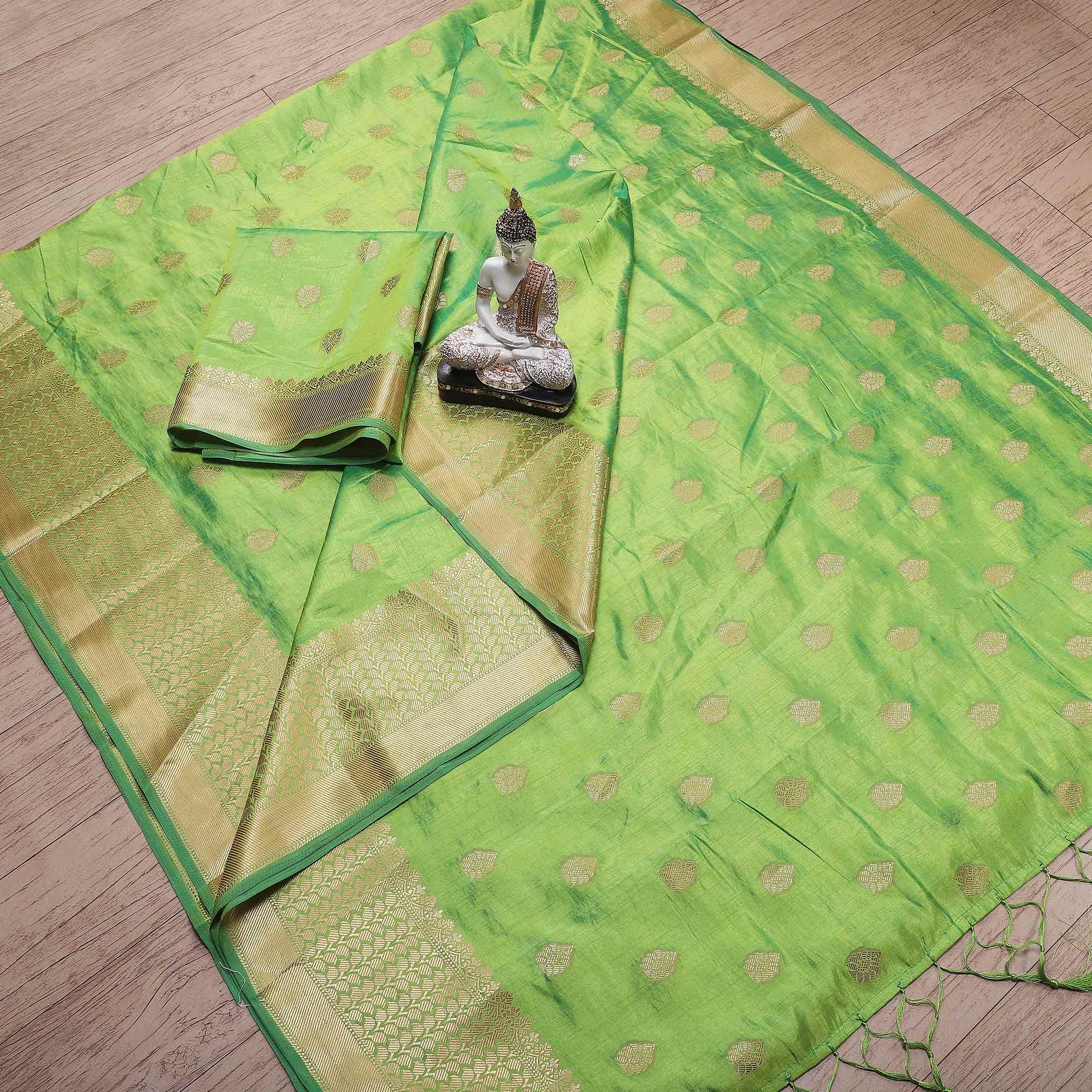 Dazzling Green Colored Festive Wear Woven Banarasi Silk Saree With Tassels - Peachmode