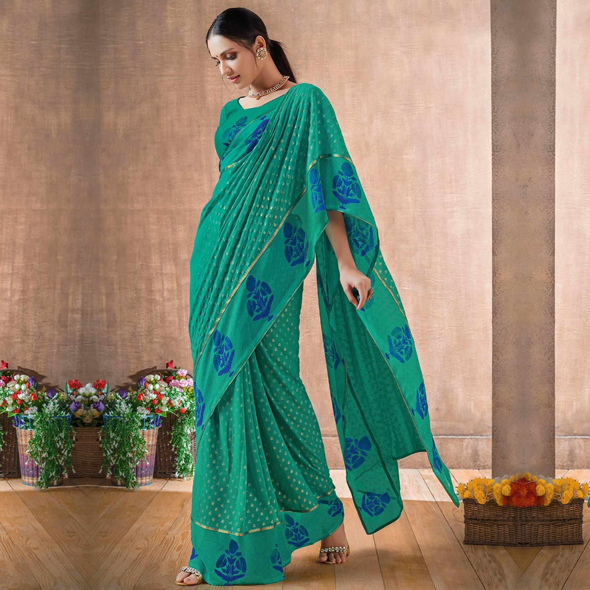 Delightful Rama Green Colored Festive Wear Foil Printed Georgette Saree - Peachmode