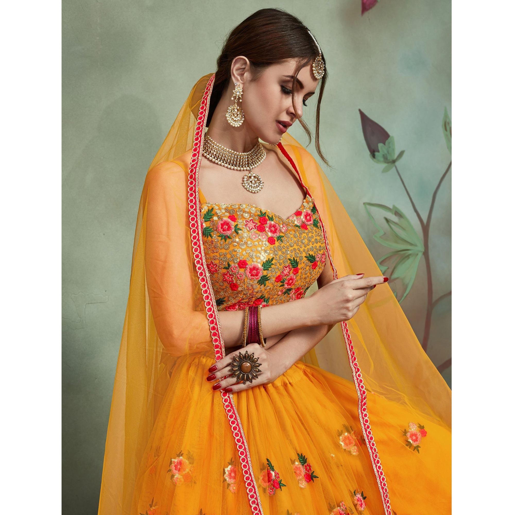 Demanding Mustard Yellow Colored Partywear Embroidered Netted Lehenga - Peachmode