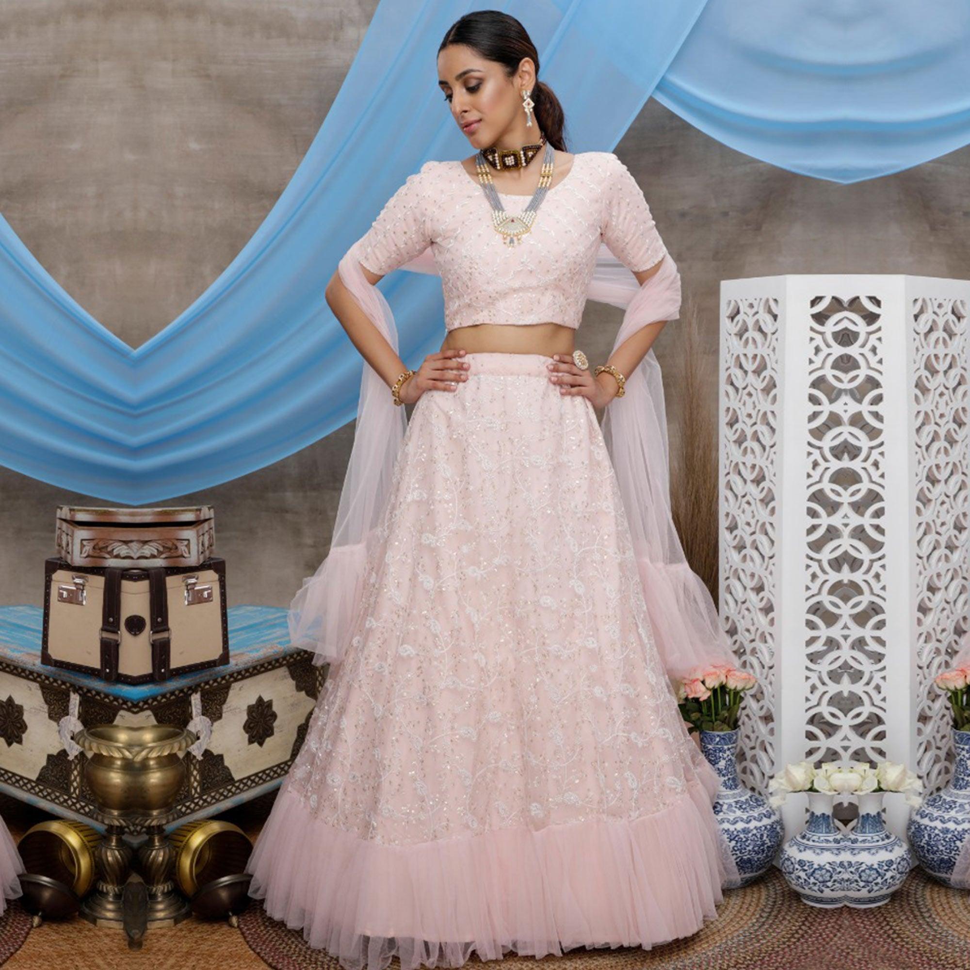 Desirable Pastel Peach Colored Party Wear Embroidered Net Lehenga Choli - Peachmode