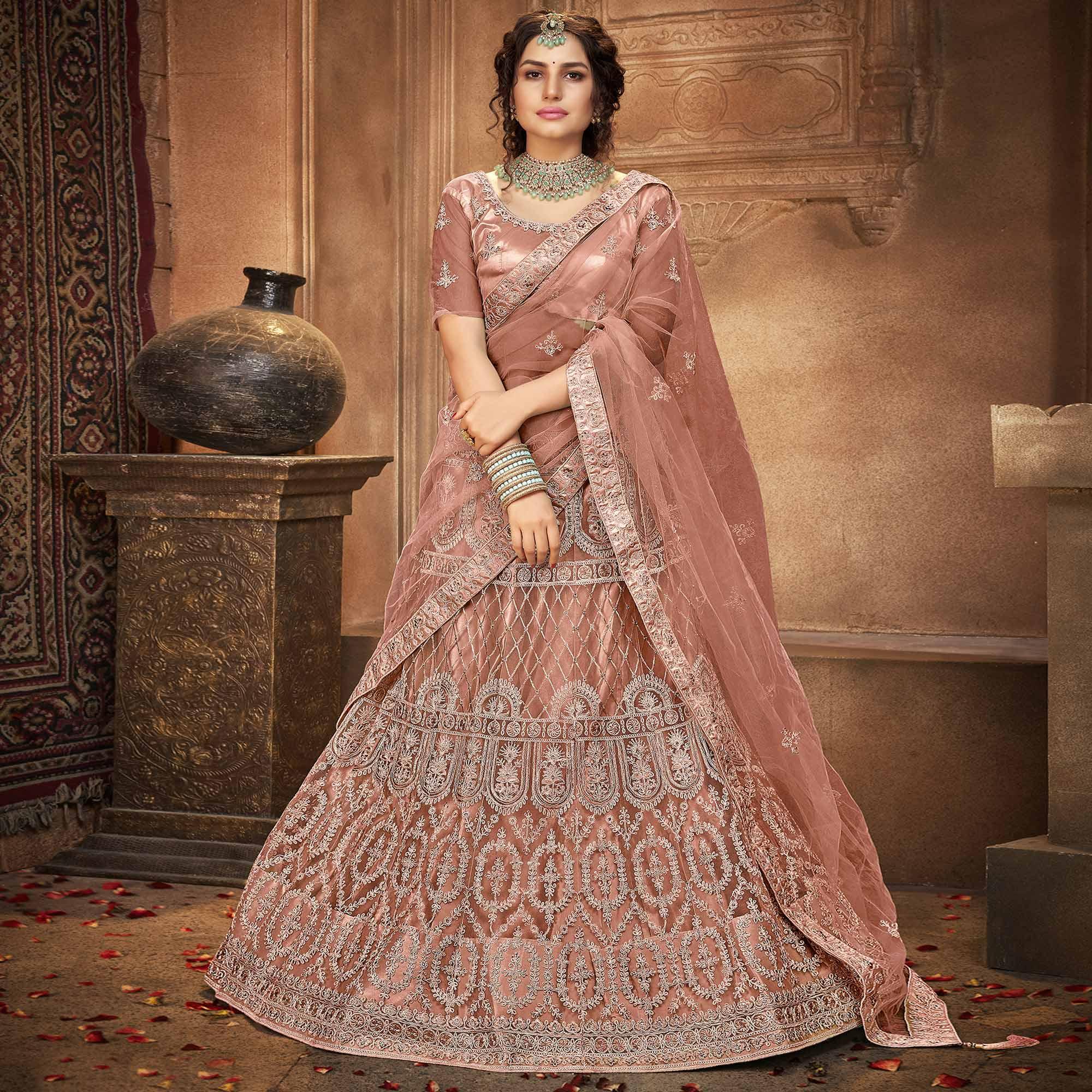 Dusty Pink Partywear Multi Sequence Embroidered Net Lehenga Choli - Peachmode