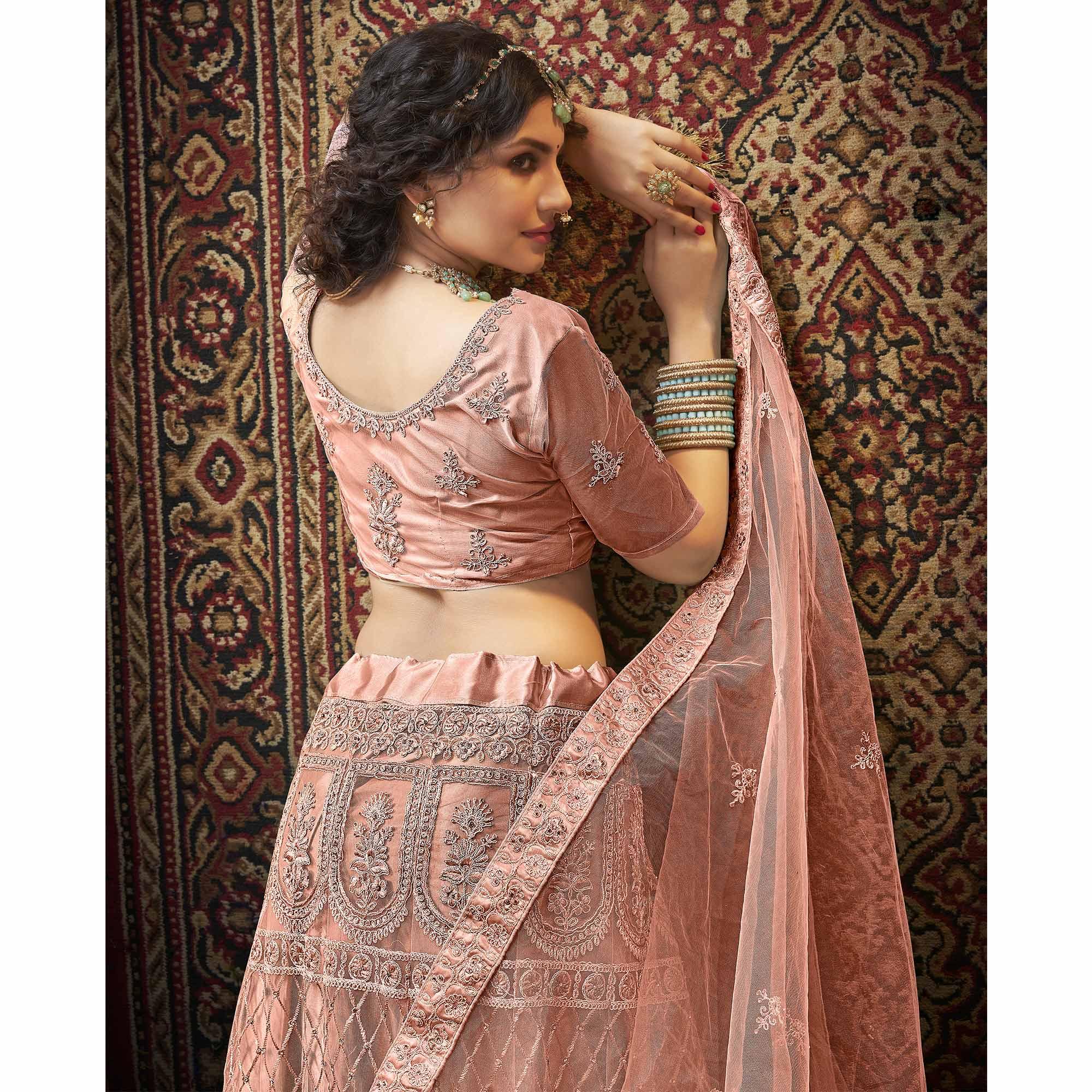 Dusty Pink Partywear Multi Sequence Embroidered Net Lehenga Choli - Peachmode