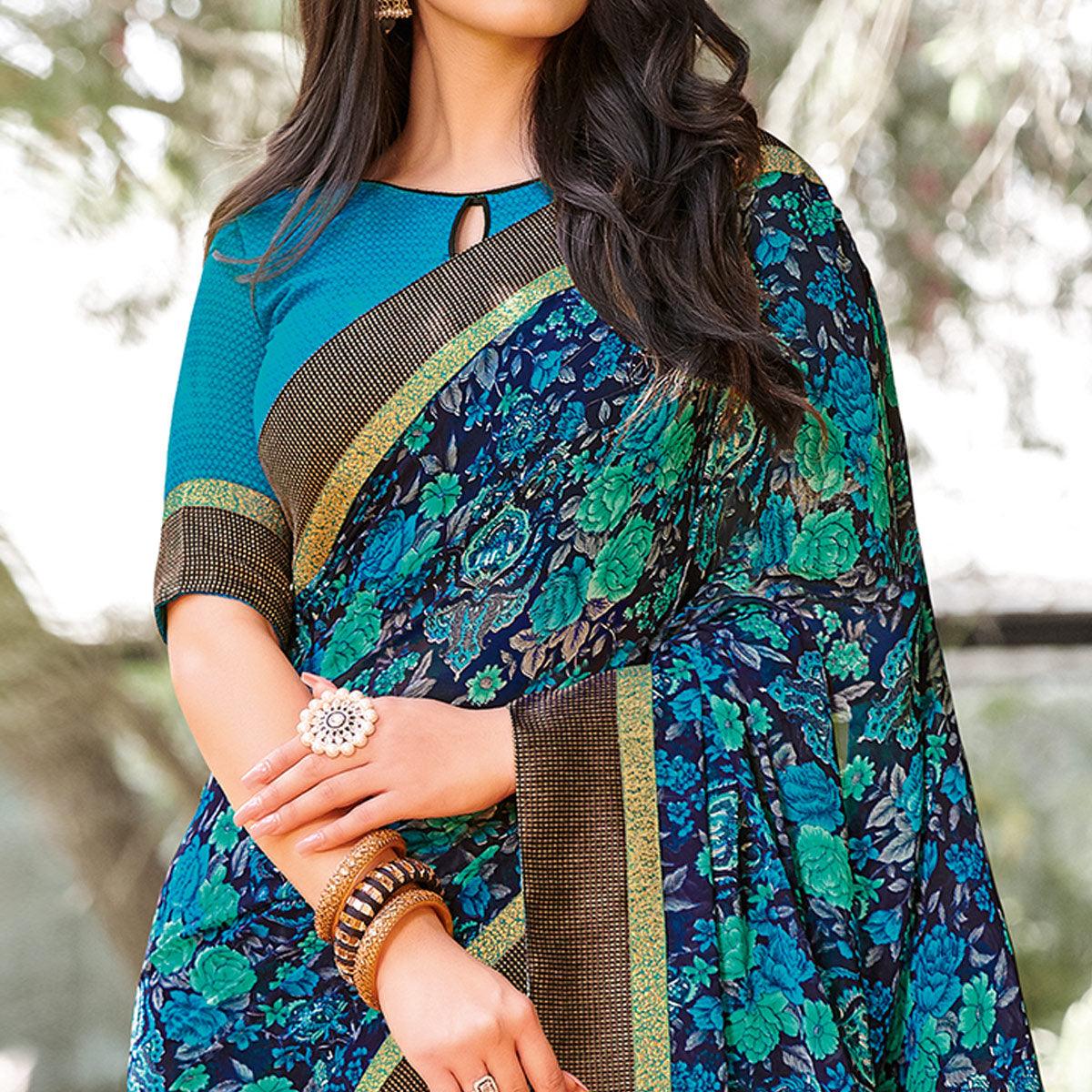 Elegant Peacock Blue Colored Partywear Printed Georgette Saree - Peachmode
