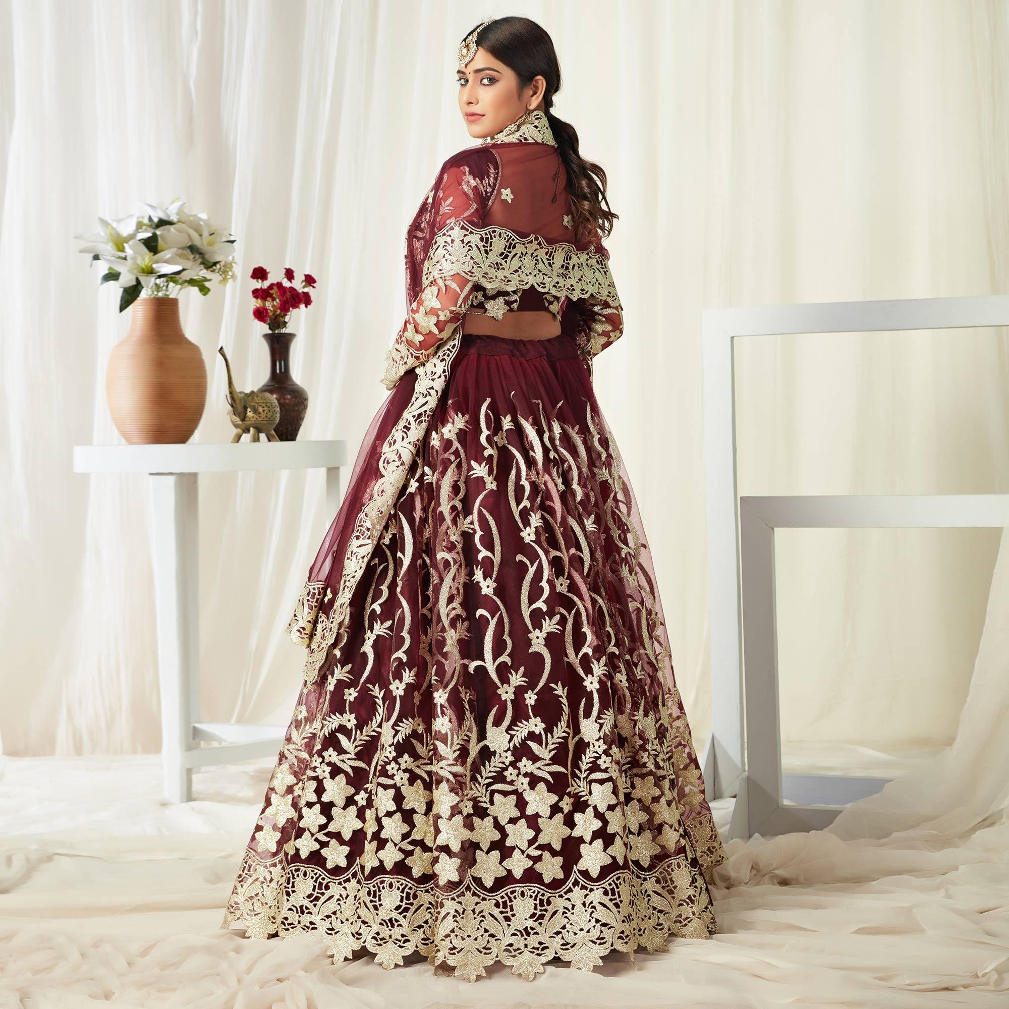 Entrancing Maroon Colored Wedding Wear Butterfly Net With Embroidered Lehenga Choli - Peachmode