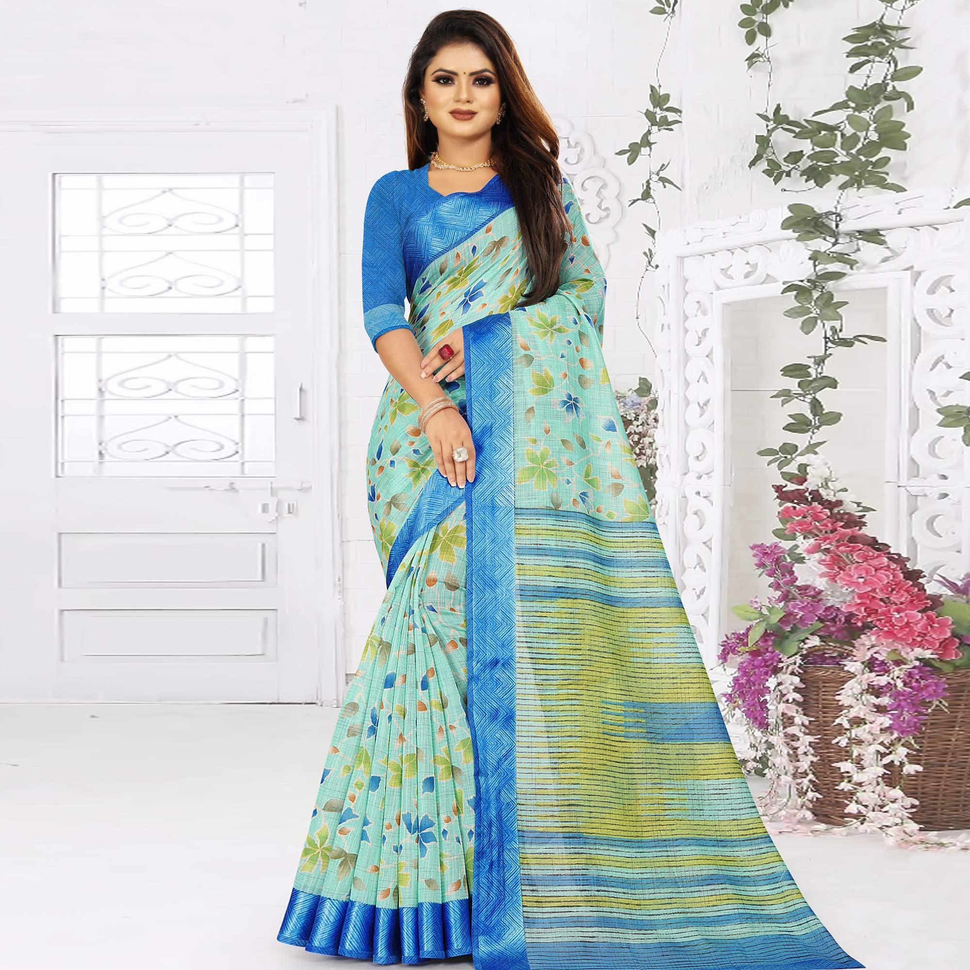 Excellent Sky Blue Colored Casual Wear Floral Printed Linen Saree With Satin Patta Border - Peachmode