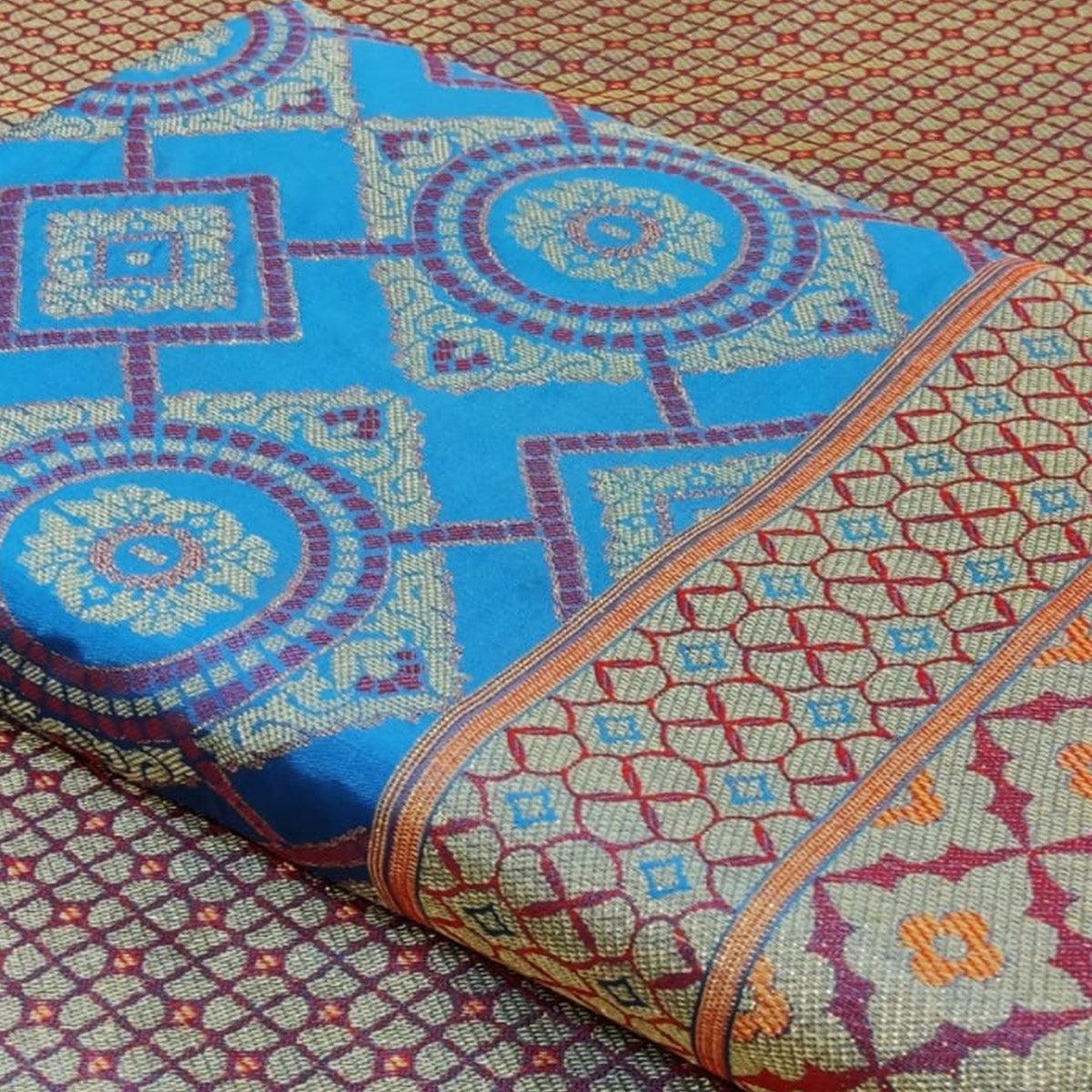 Exclusive Sky Blue Colored Festive Wear Woven Patola Silk Saree - Peachmode
