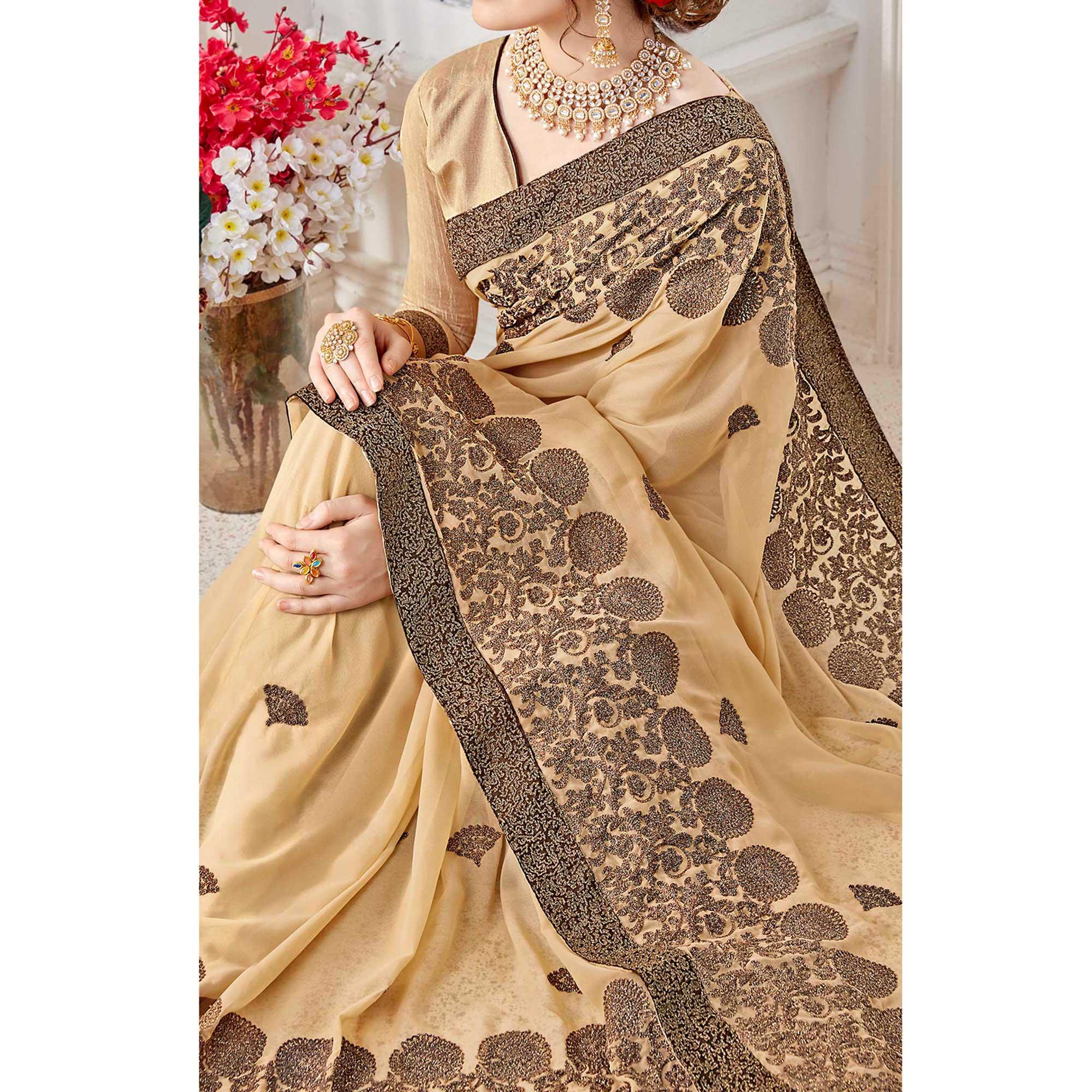 Exotic Beige Colored Partywear Embroidered Georgette Saree - Peachmode