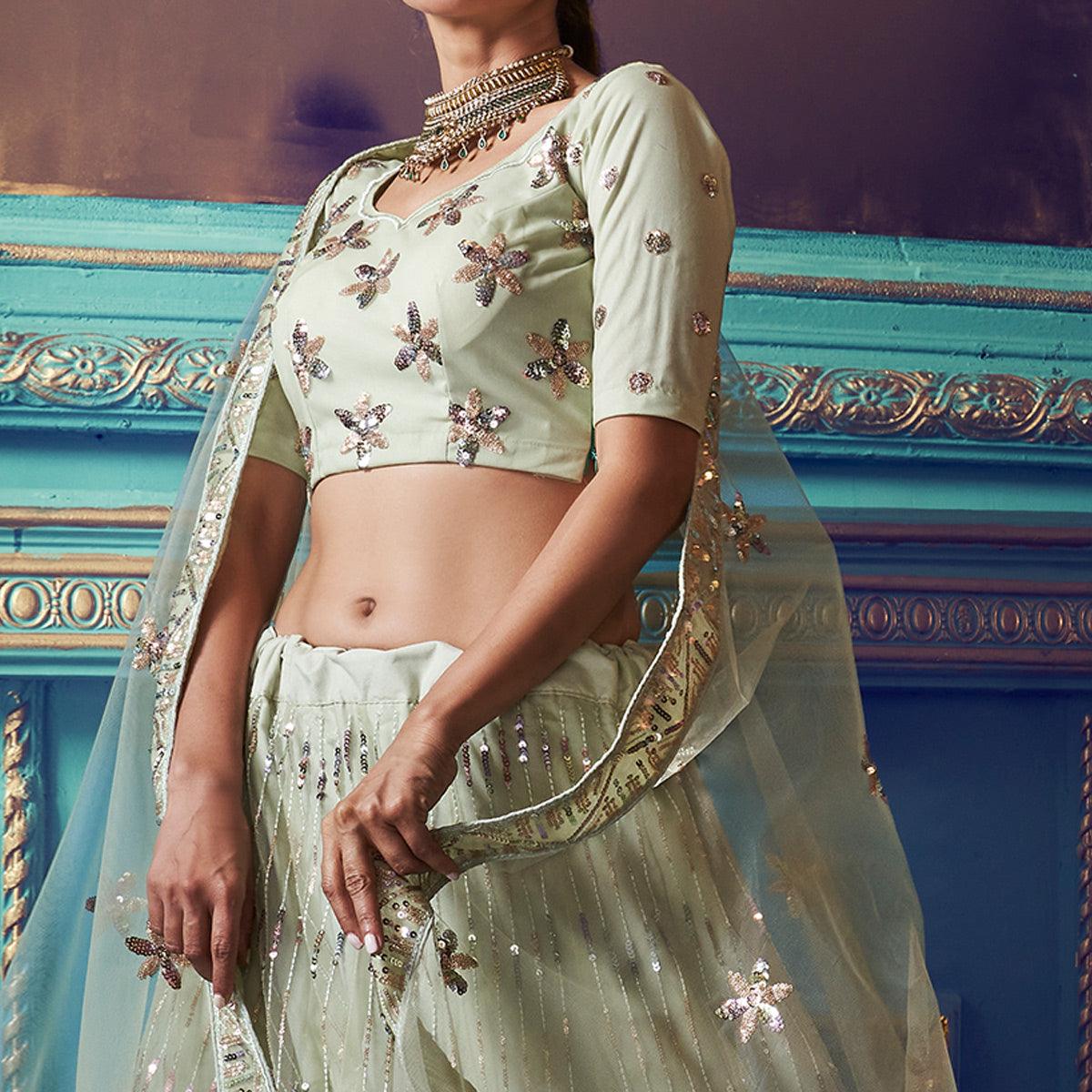 Exotic Pastel Green Colored Partywear Embroidered Soft Net Lehenga Choli - Peachmode