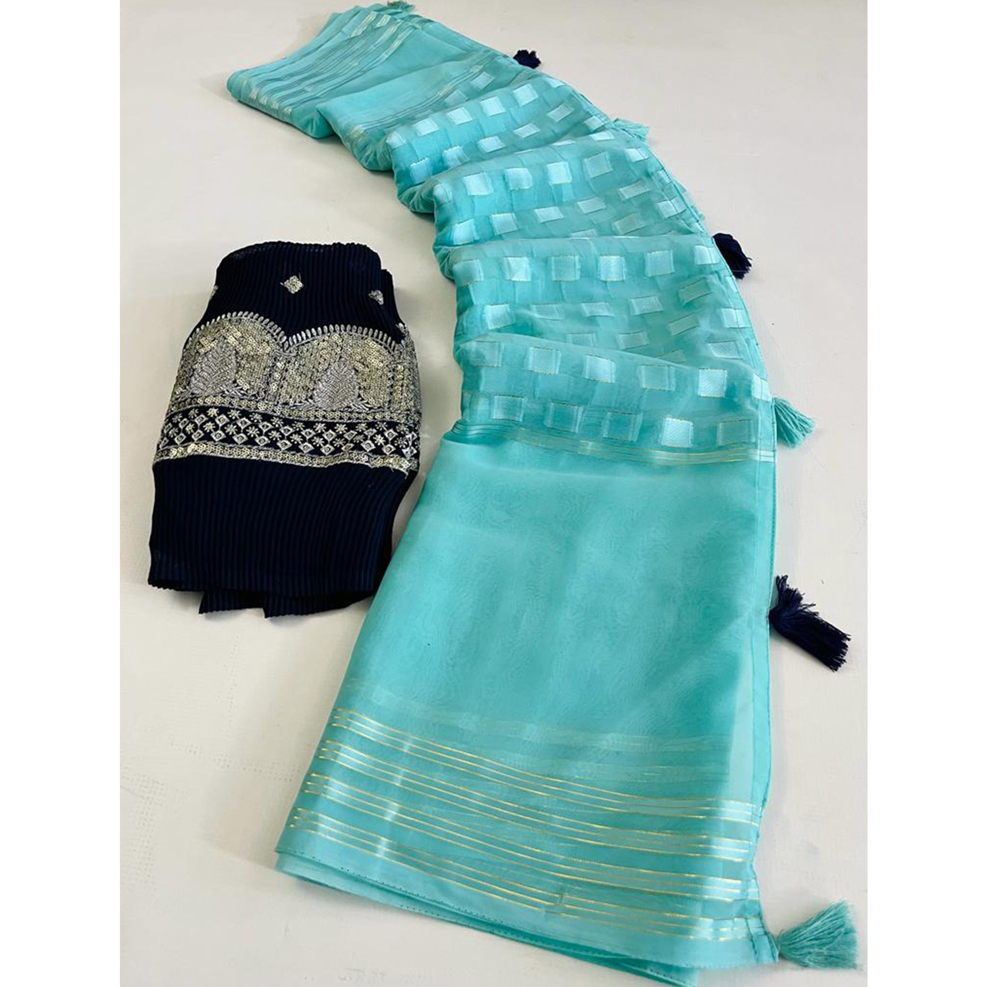 Turquoise Woven Georgette Saree With Tassels