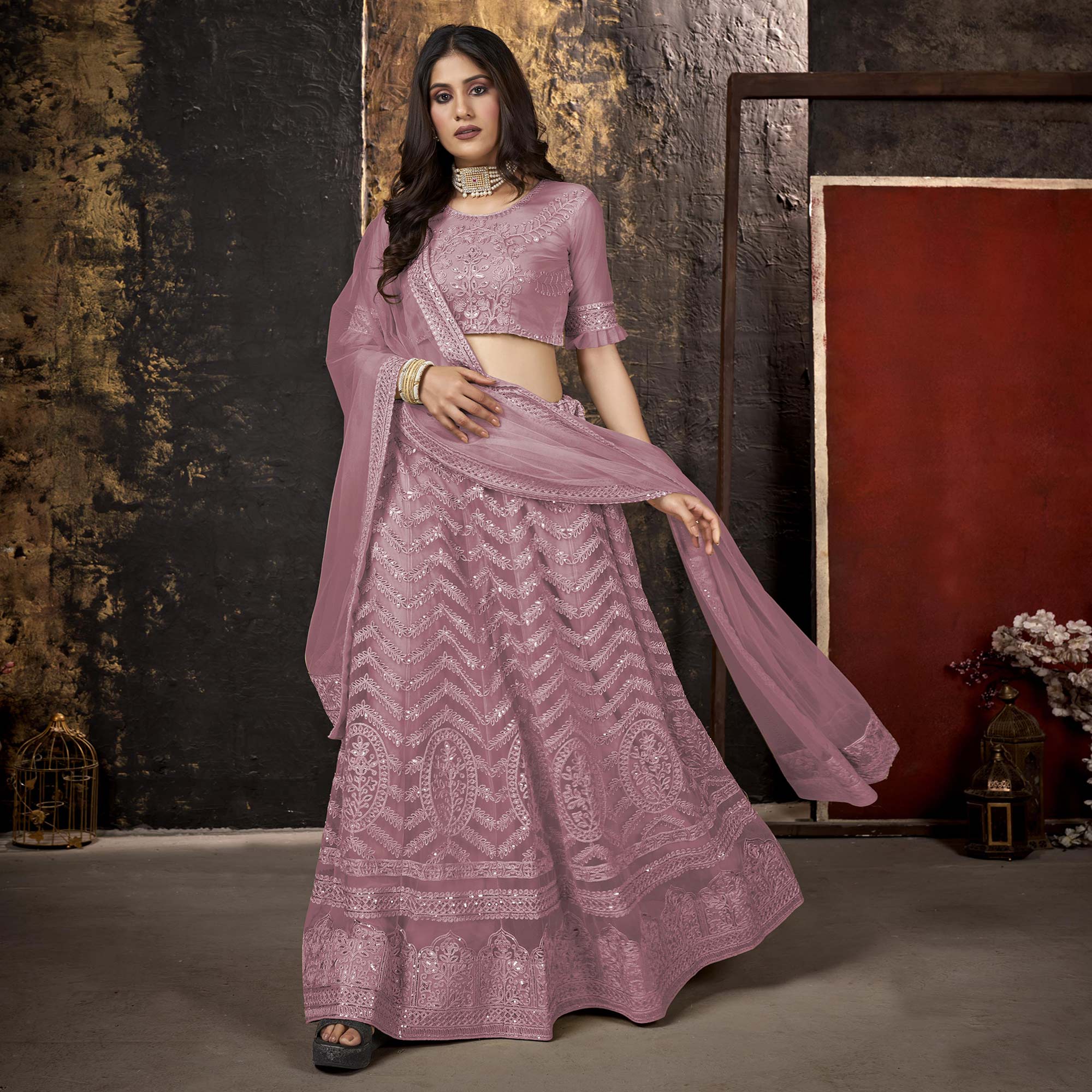 Mauve Heavy Embroidered Netted Lehenga Choli