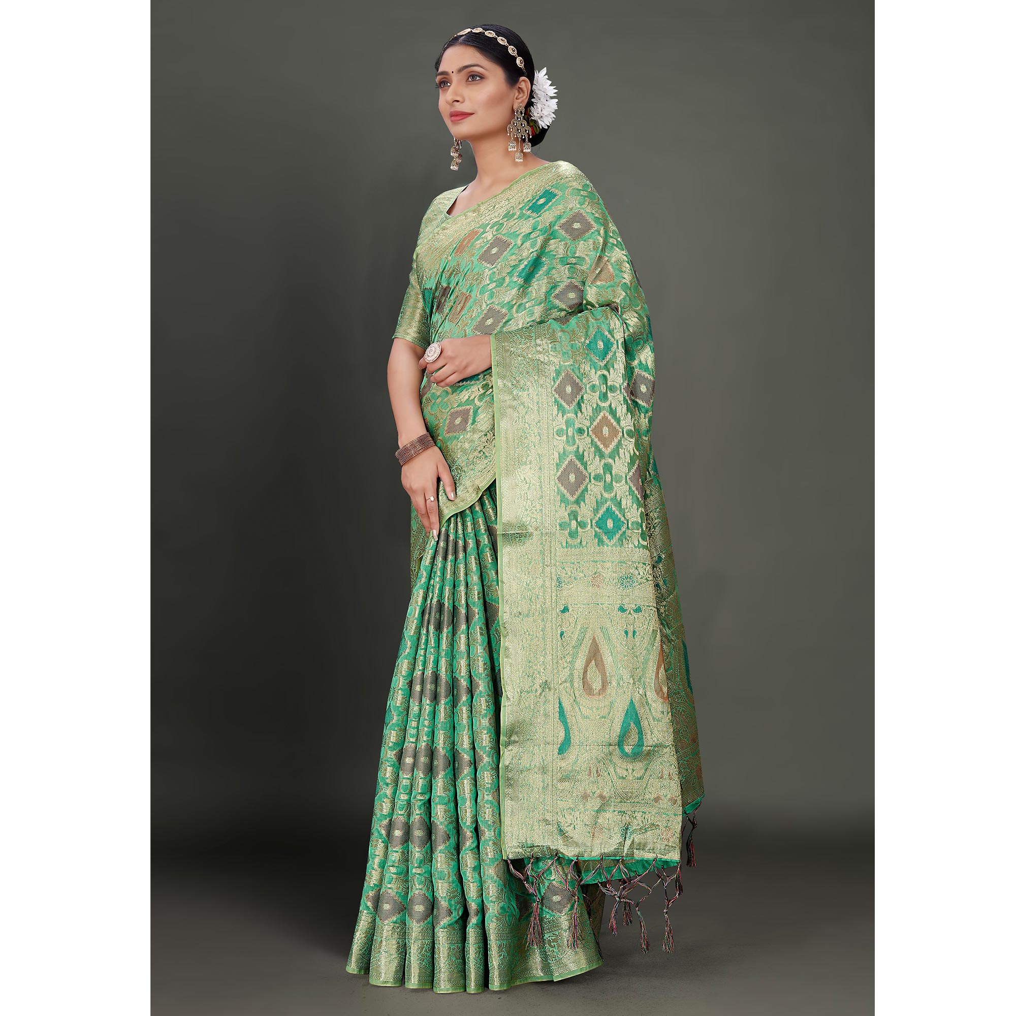 Rama Green Woven Organza Saree With Tassels
