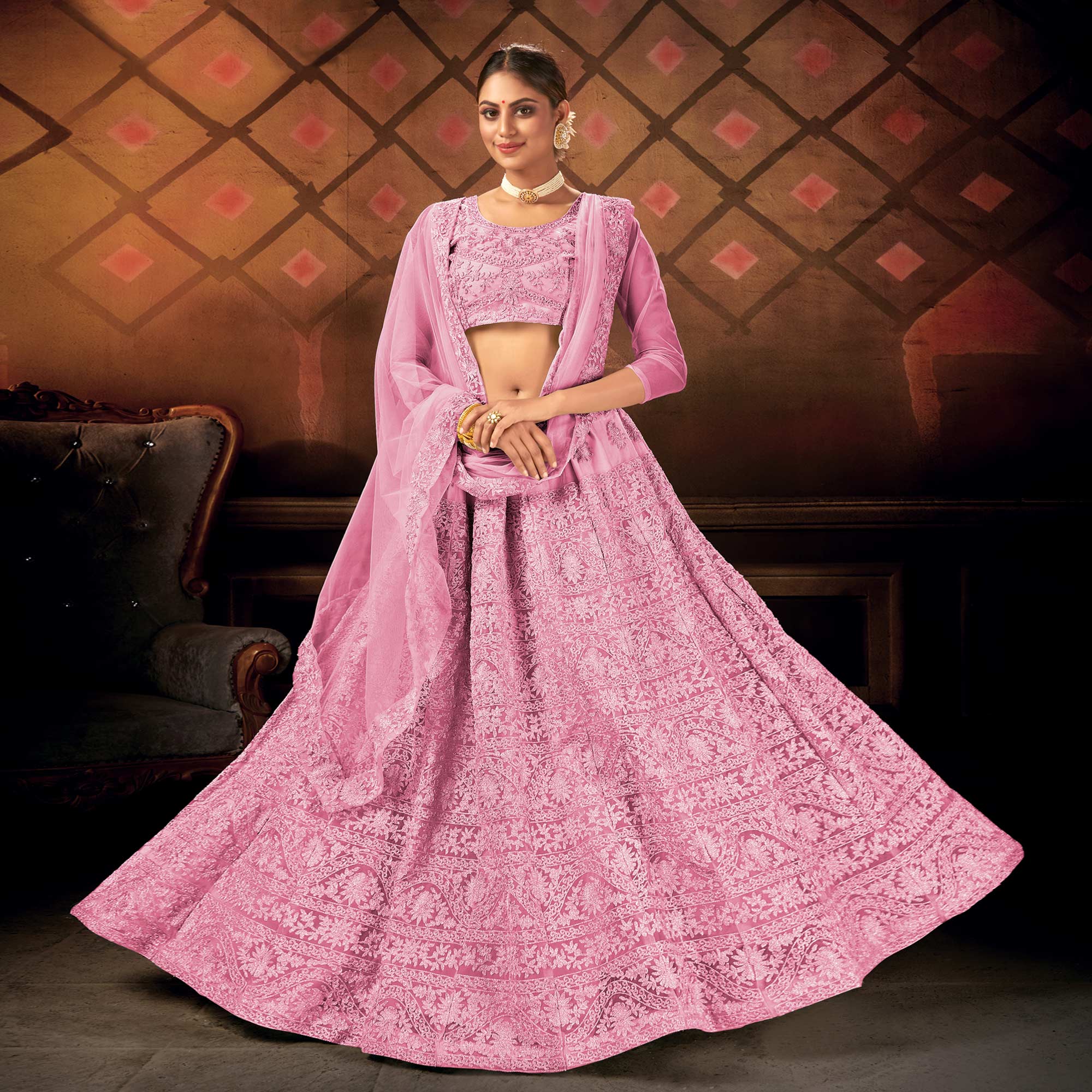 Pink Embroidered Netted Lehenga Choli