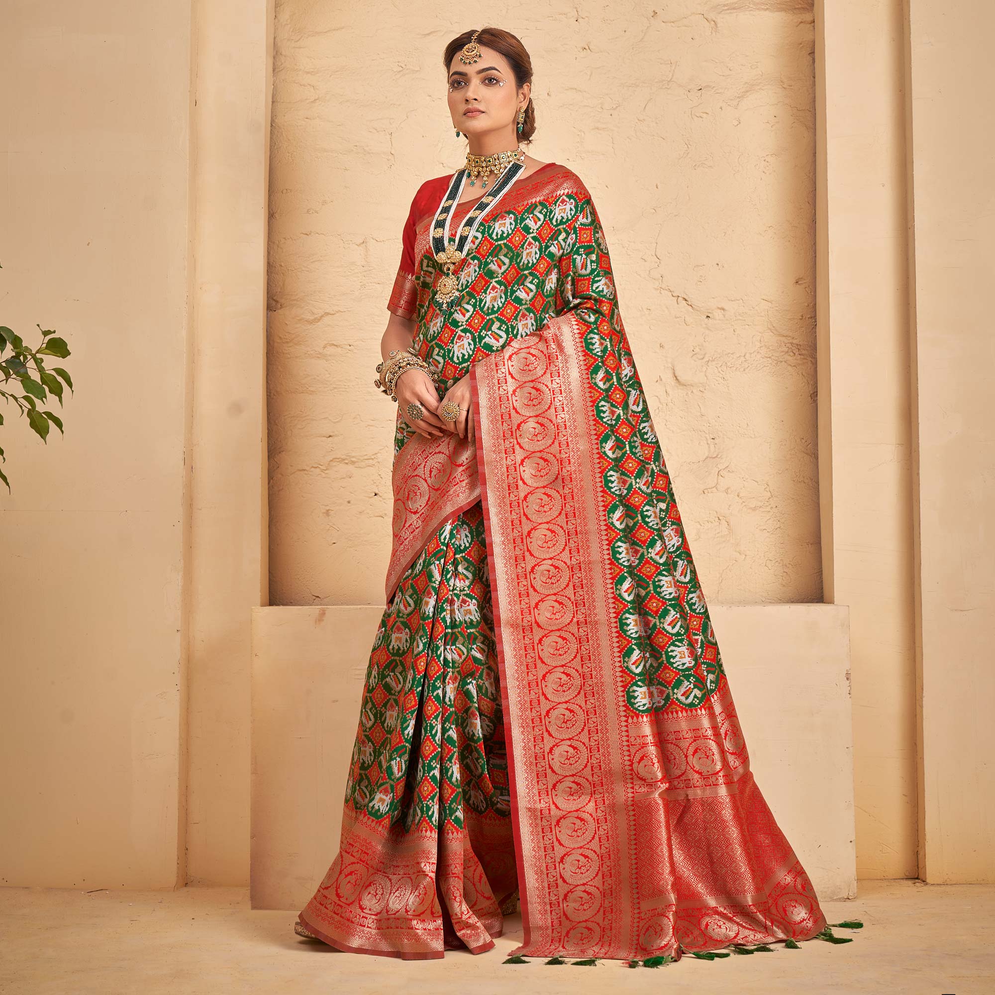 Green Woven Patola Art Silk Saree With Tassels