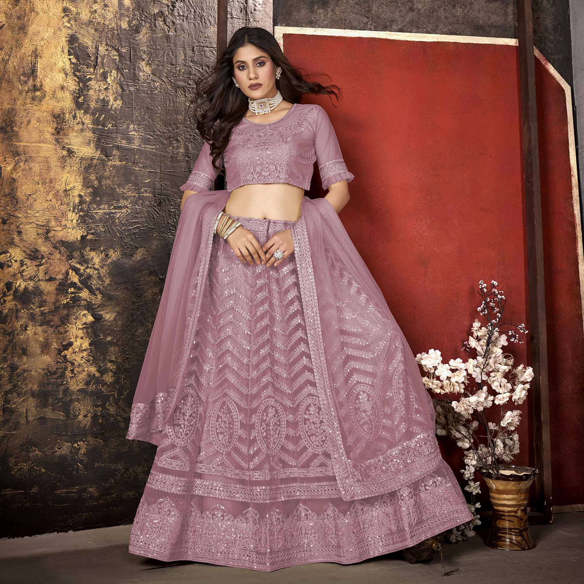 Mauve Heavy Embroidered Netted Lehenga Choli