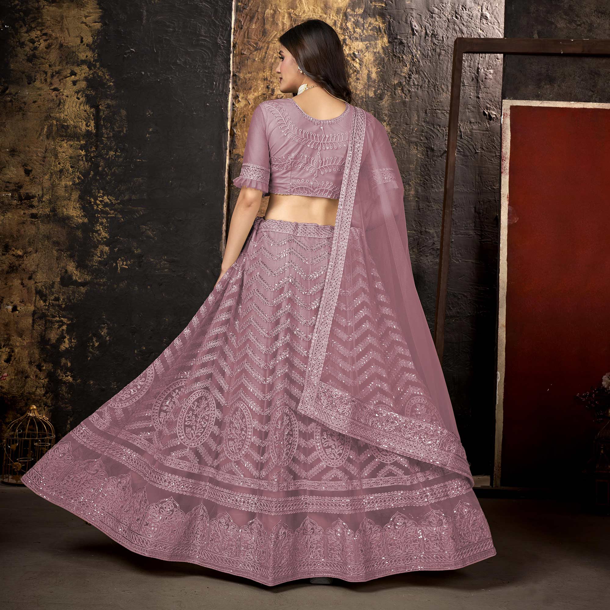 Mauve Heavy Embroidered Netted Lehenga Choli