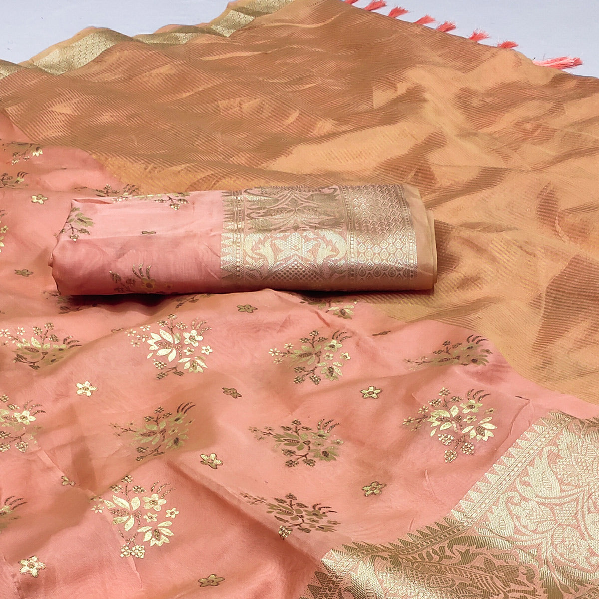 Peach Woven Organza Saree With Tassels