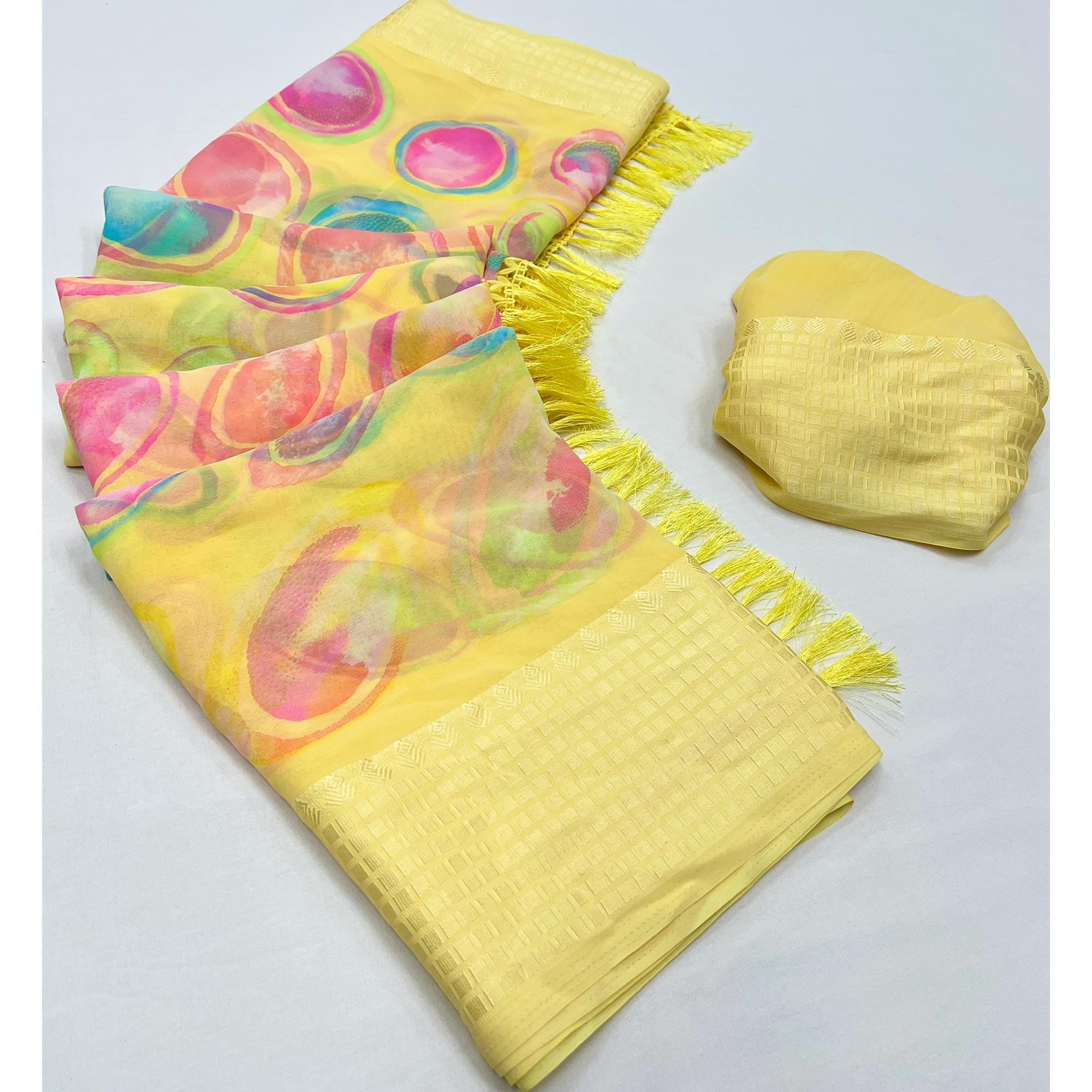 Yellow Printed Georgette Saree With Tassels