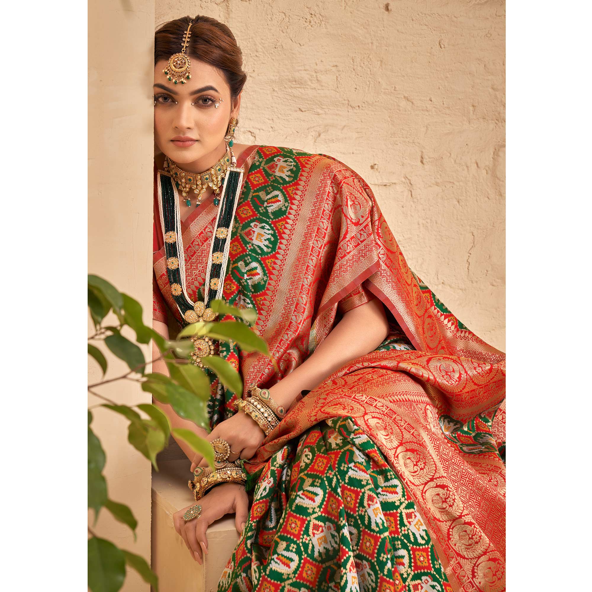 Green Woven Patola Art Silk Saree With Tassels