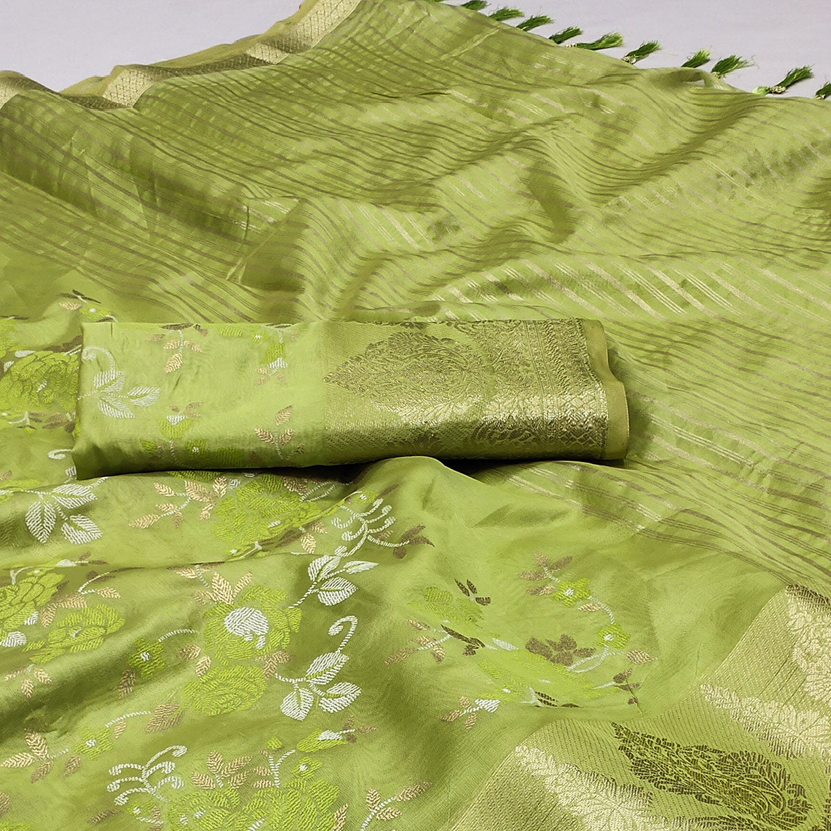 Green Woven Organza Saree With Tassels