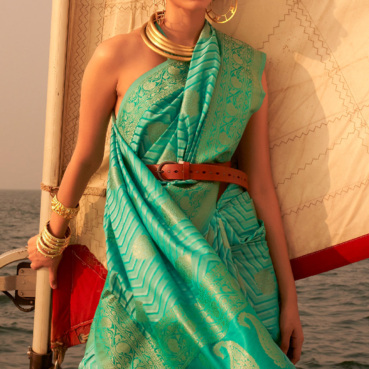 Sea Green Woven Satin Saree With Tassels