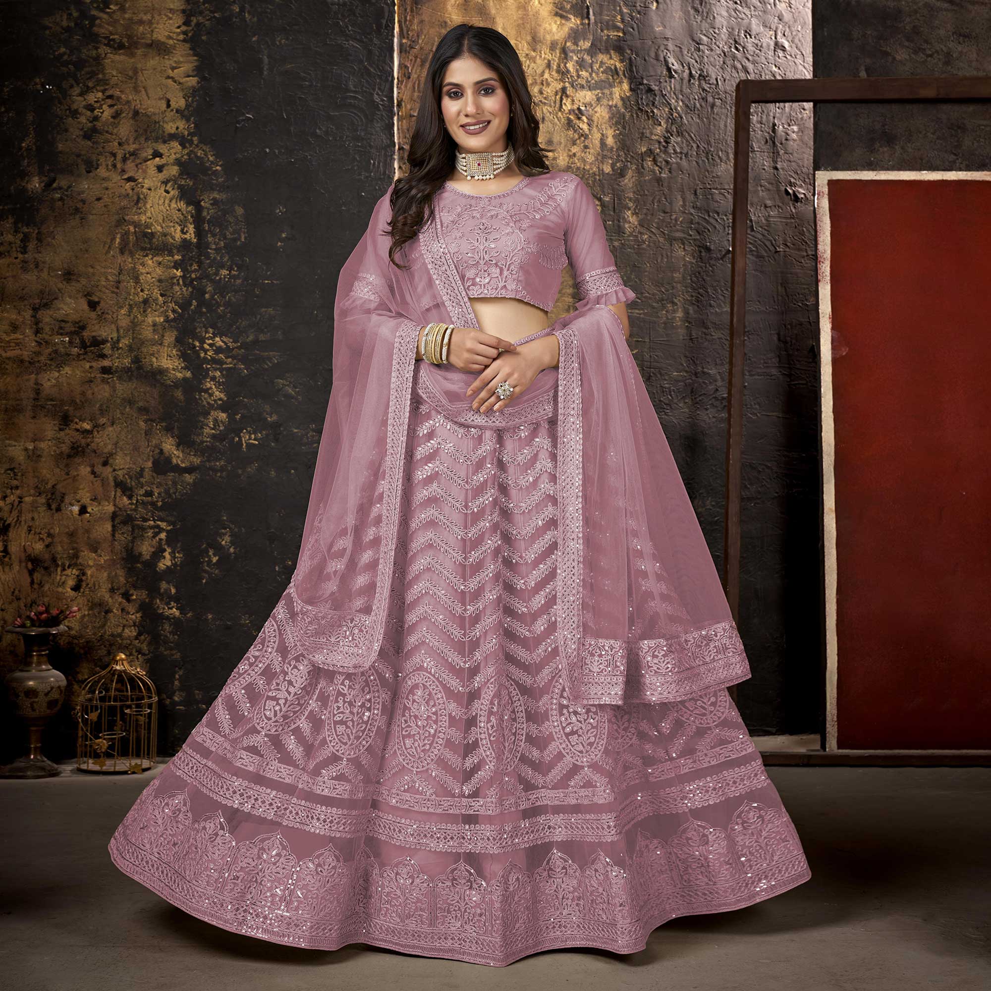 Mauve Heavy Embroidered Netted Lehenga Choli