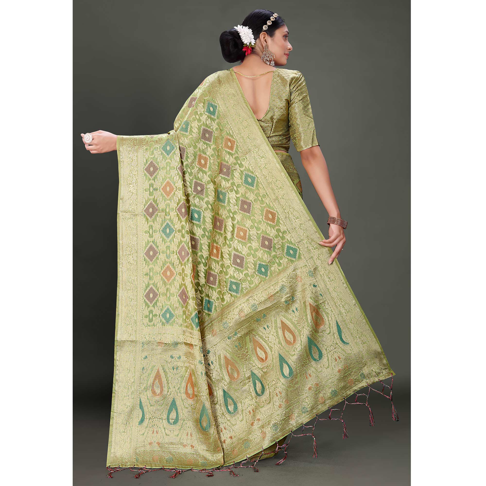 Green Woven Organza Saree With Tassels