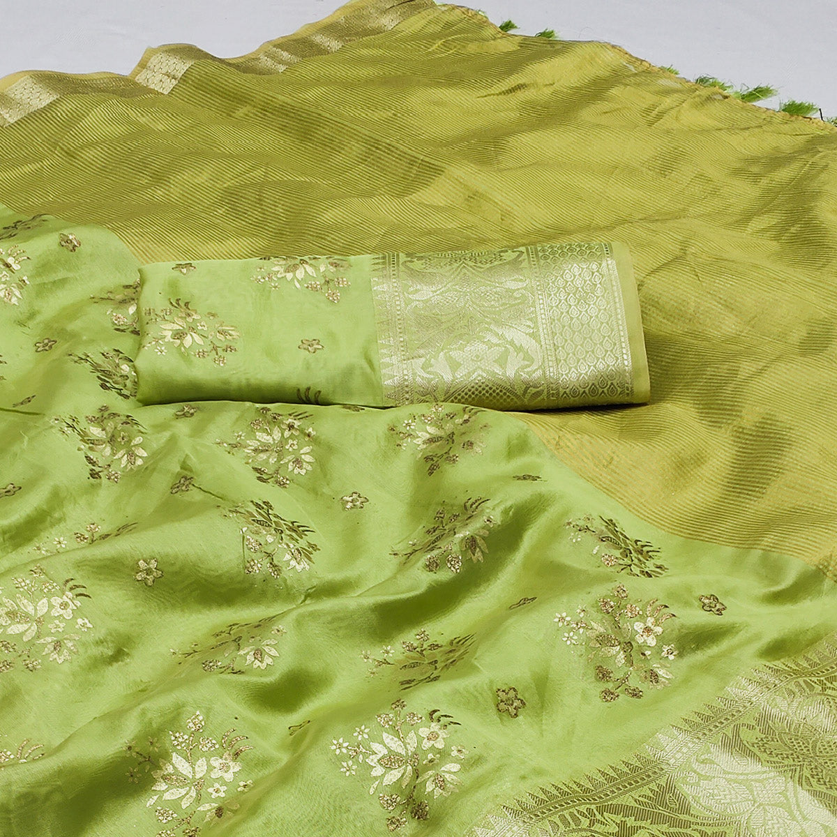 Green Woven Organza Saree With Tassels