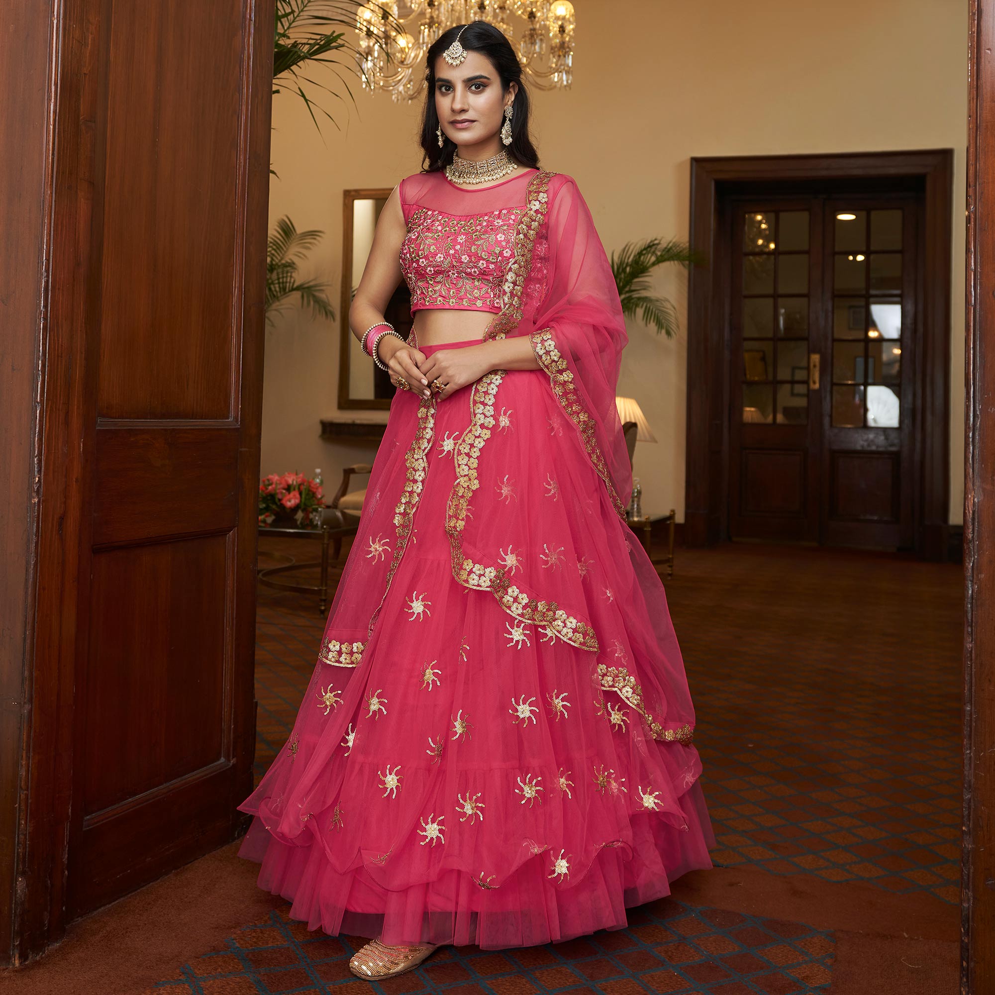 Bright Pink Sequins Embroidered Netted Lehenga Choli