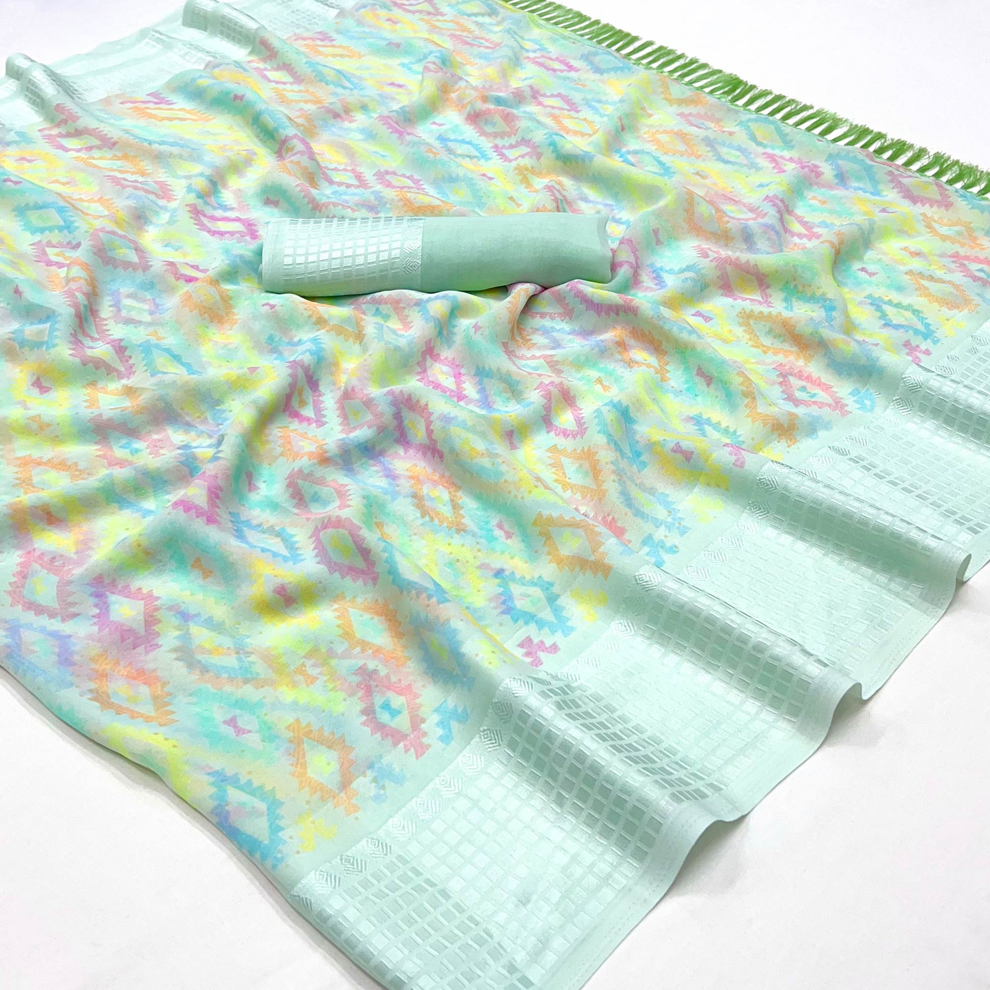 Sea Green Printed Georgette Saree With Tassels