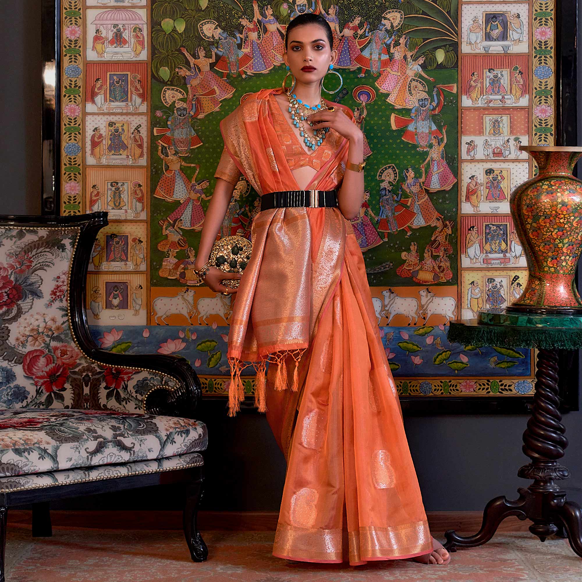 Orange Woven Organza Saree With Tassels