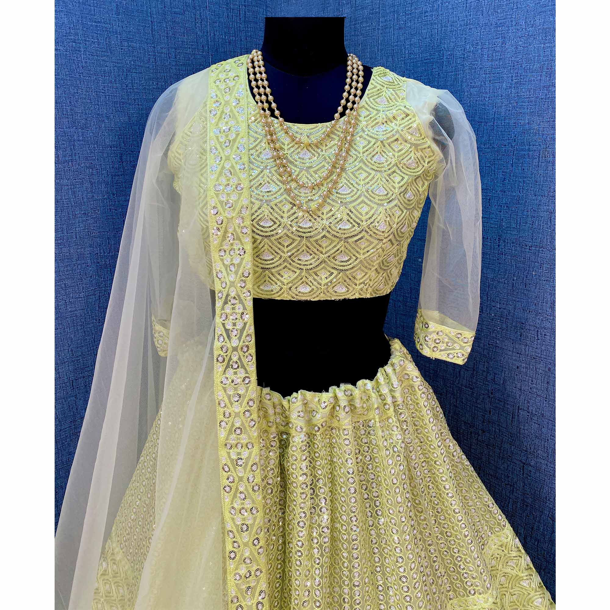 Lemon Yellow Sequins Embroidered Netted Lehenga Choli
