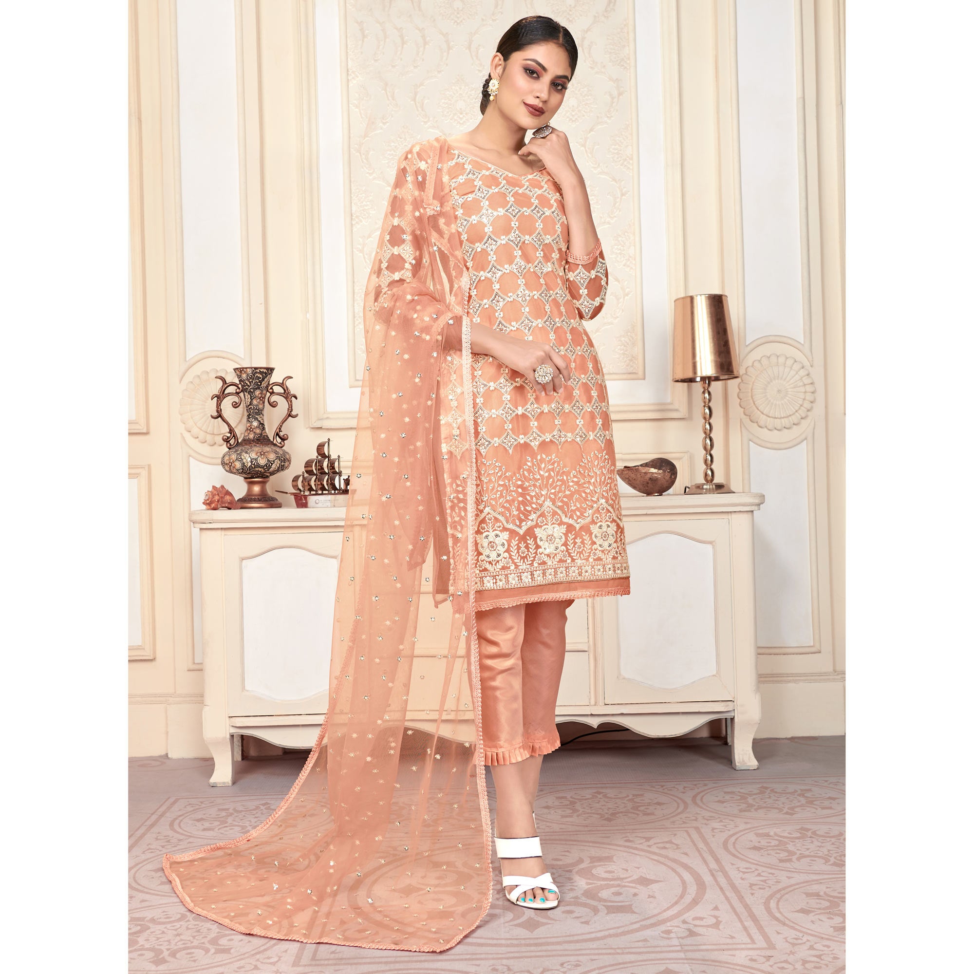 Peach Sequins Embroidered Net Semi Stitched Suit