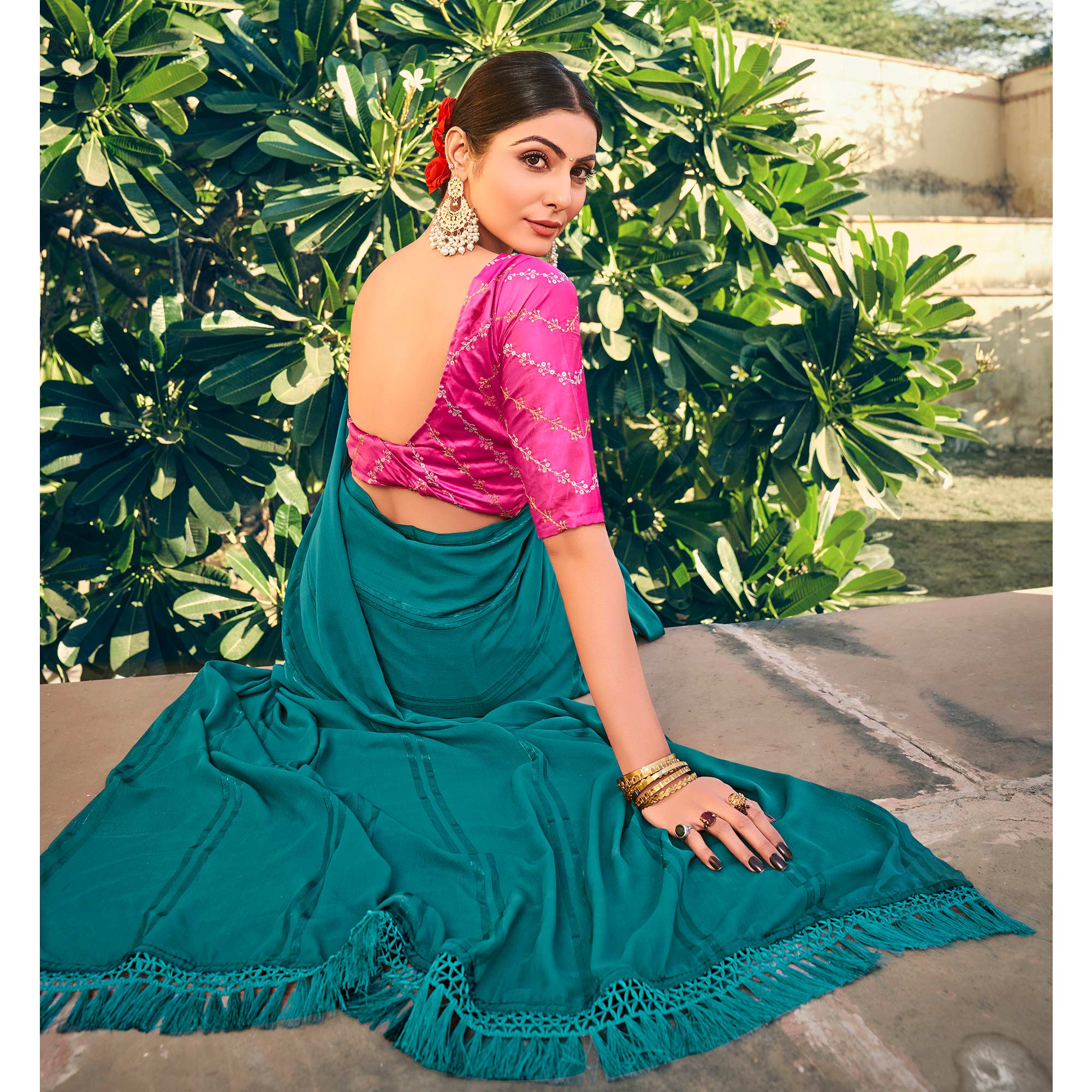 Teal Blue Printed Georgette Saree With Tassels