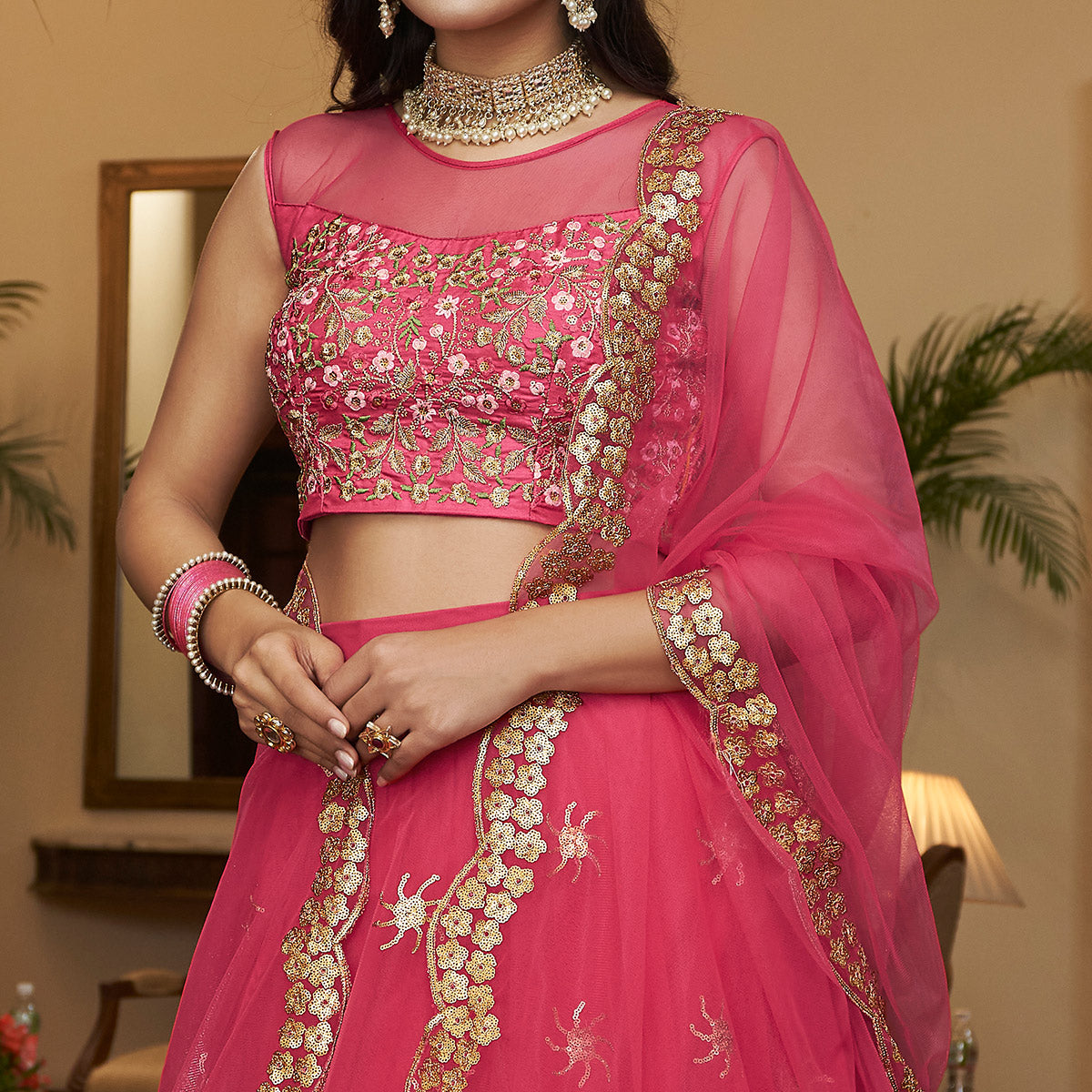 Bright Pink Sequins Embroidered Netted Lehenga Choli