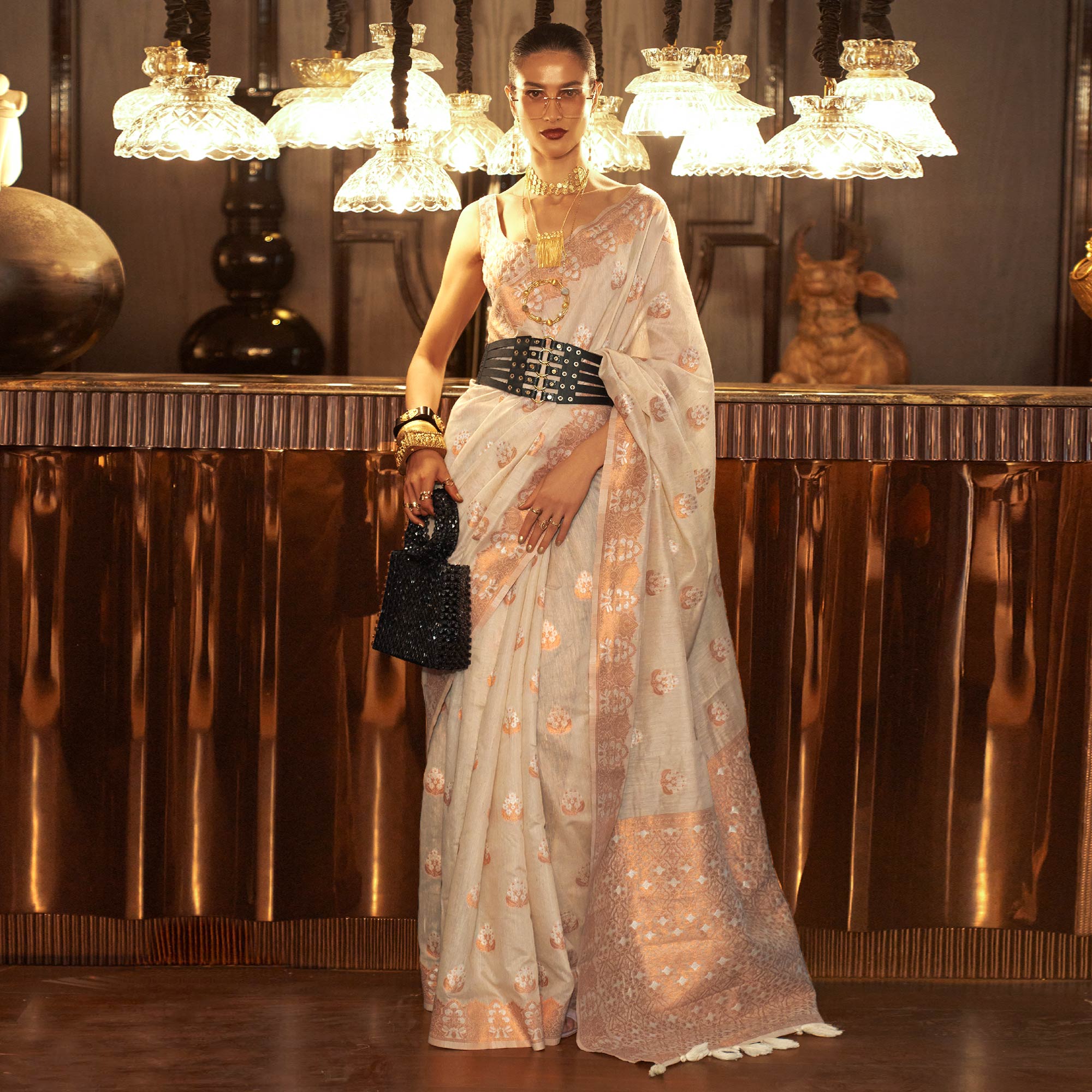 Beige Woven Linen Saree With Tassels