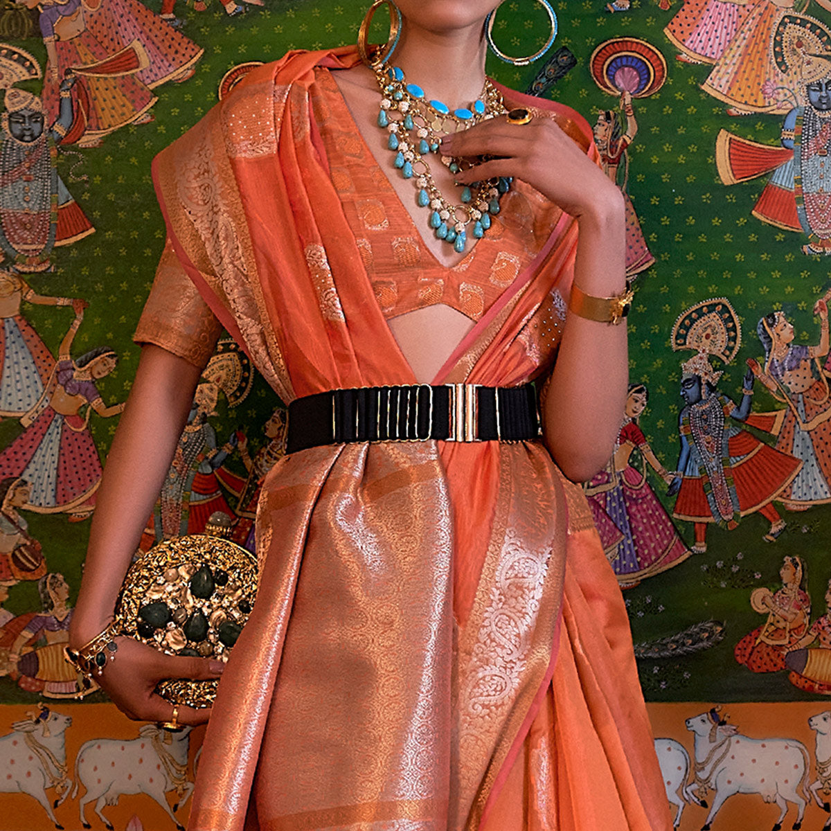 Orange Woven Organza Saree With Tassels