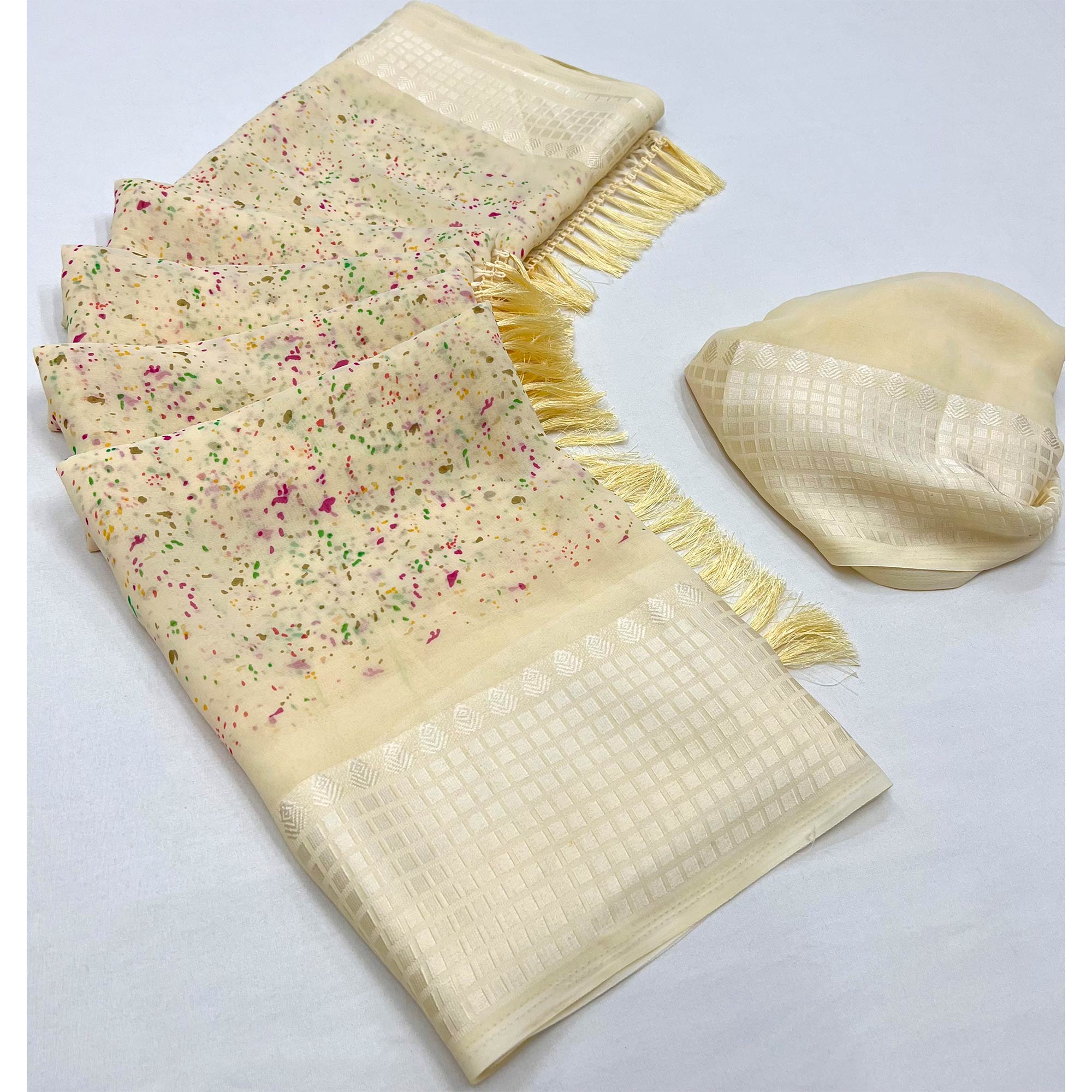 Cream Printed Georgette Saree With Tassels