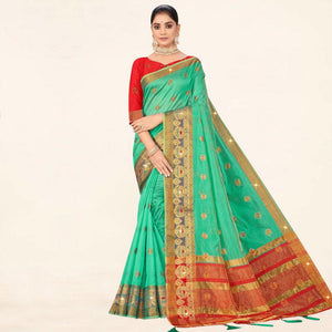 Turquoise Woven Organza Saree With Tassels