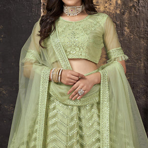 Pista Green Heavy Embroidered Netted Lehenga Choli